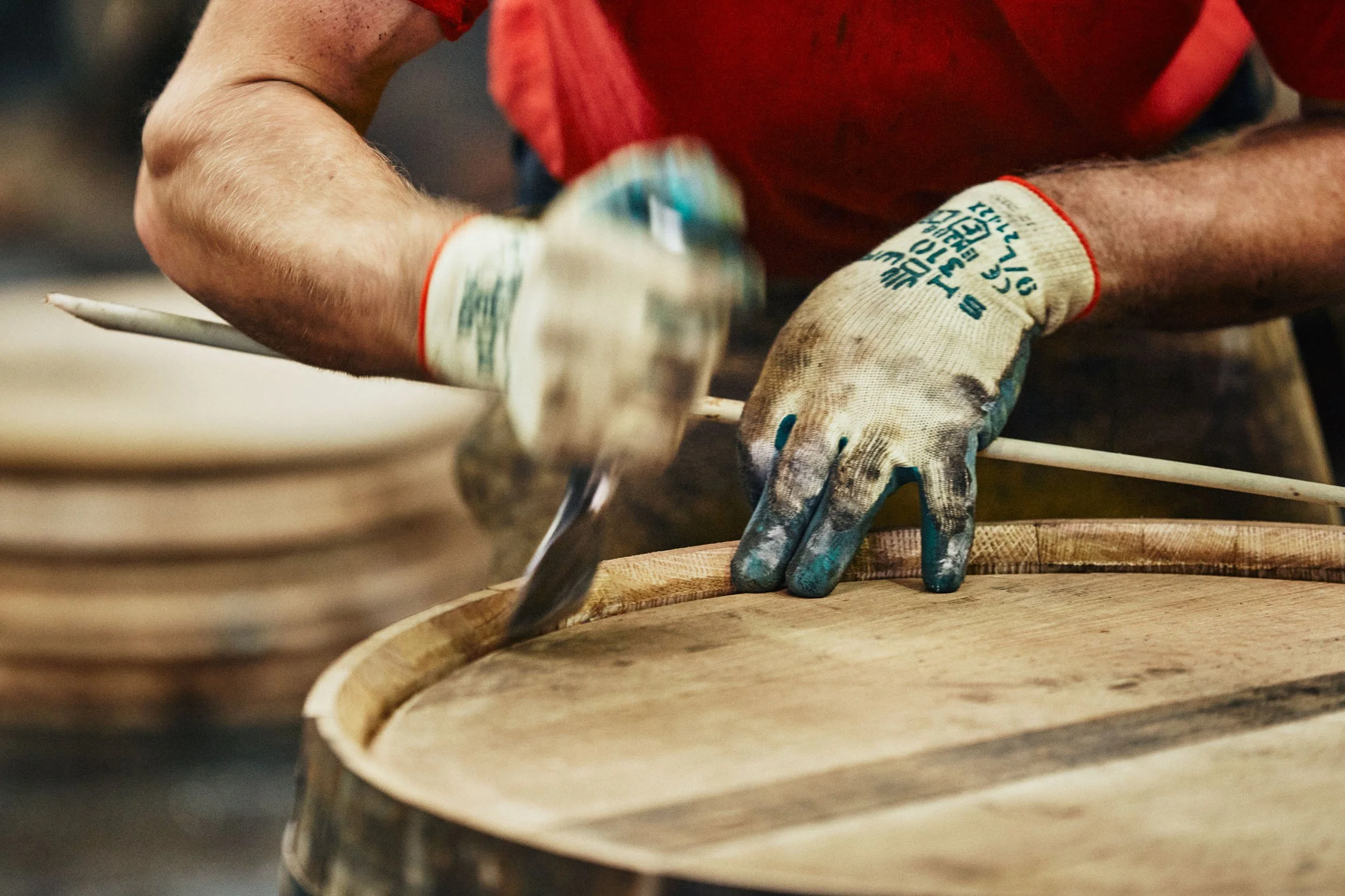  A cooper prepares to insert a reed to seal the cask 