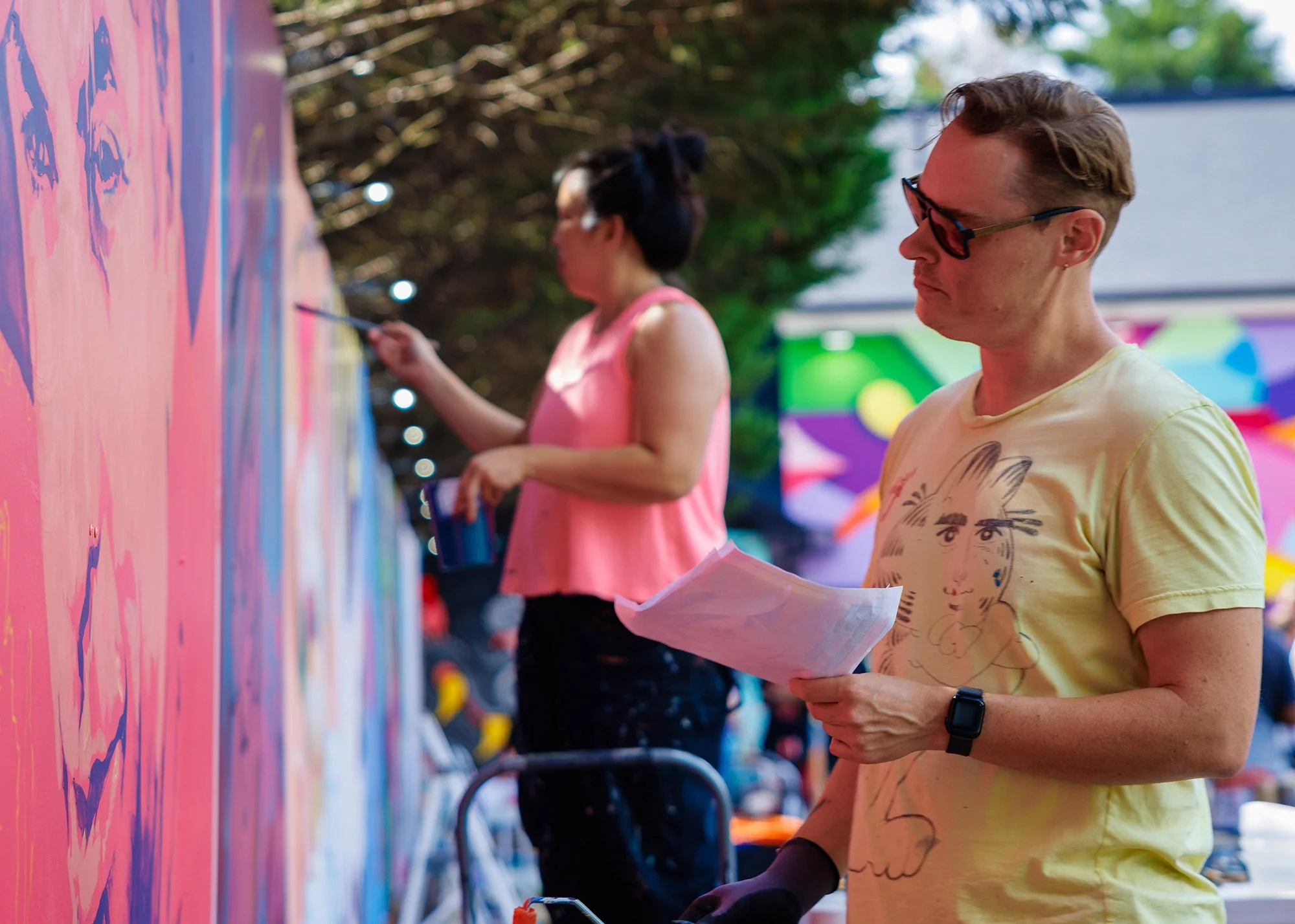 Mural artist preparing artwork at The Art Yard at ABV Gallery.