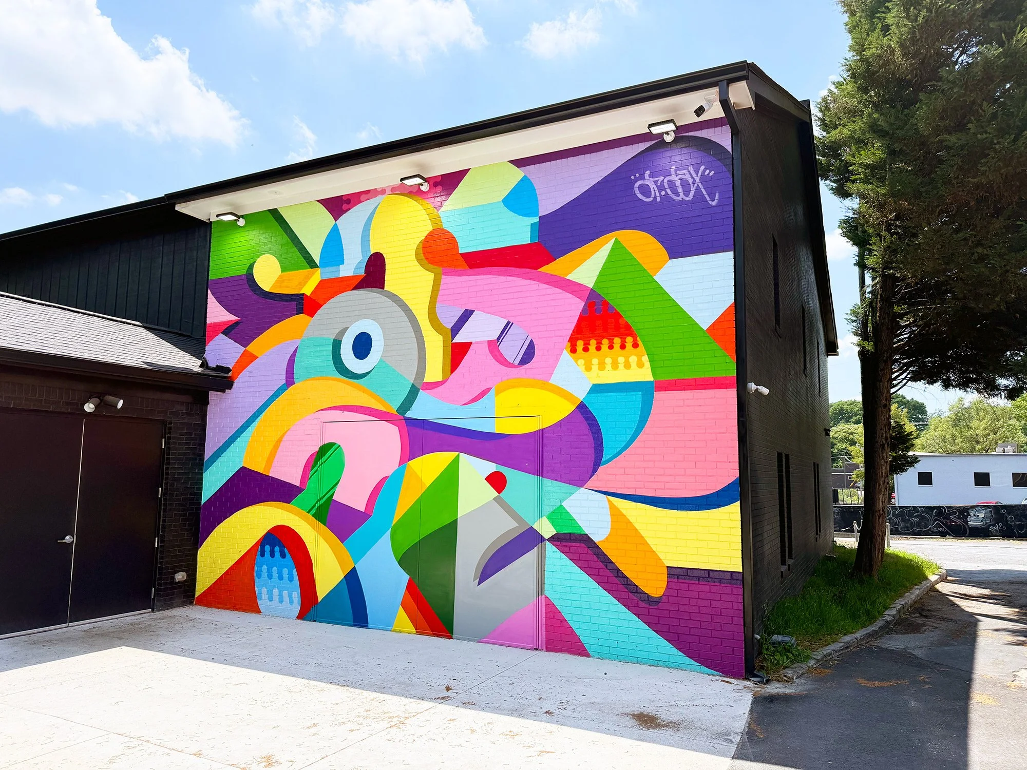 Large colorful mural wall at The Art Yard outdoor art space in East Atlanta Village, Atlanta.