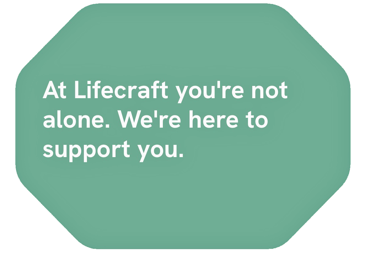 A green hexagon-shaped sign with white text that reads, 'At Lifecraft you're not alone. We're here to support you.'