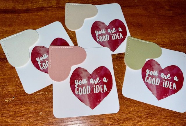 Five small cards with bookmark corners & watercolour heart designs and the message "You are a good idea" mental health