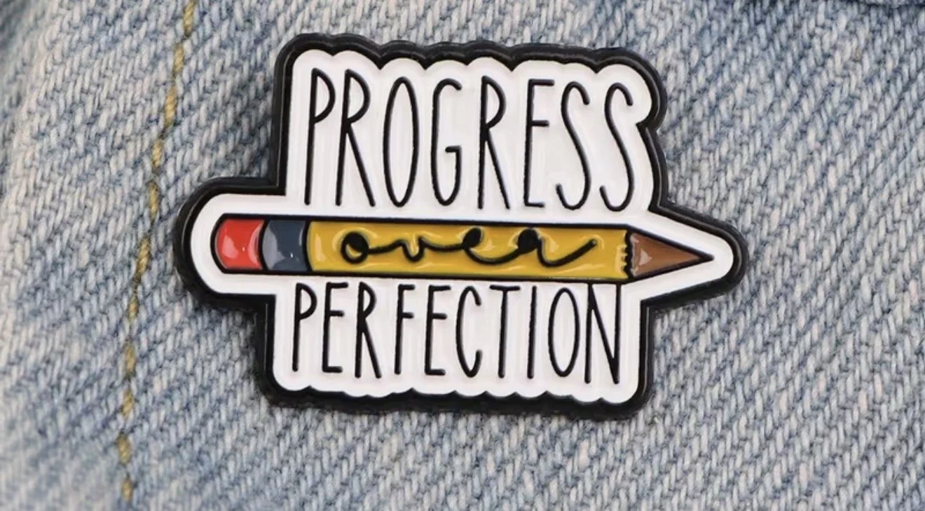 A badge with the words 'Progress over Perfection' and a yellow pencil graphic. Mental Health (Anchored Thoughts)
