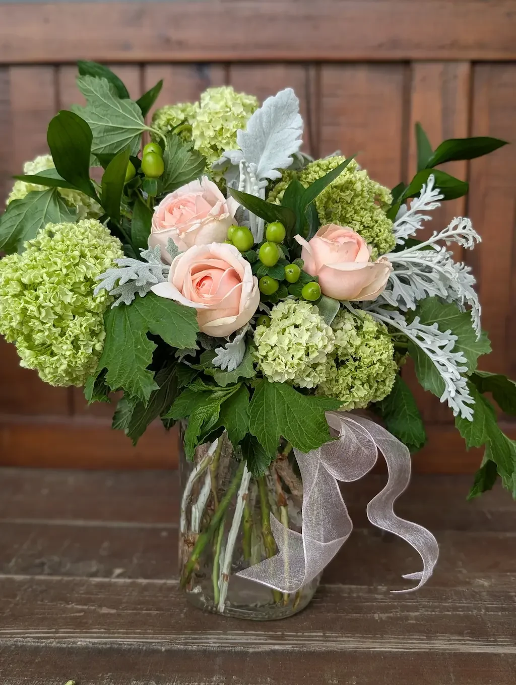 Breemar Flower Farm white sympathy arrangement with garden roses and viburnum in a clear hammered vase, Ashland VA.