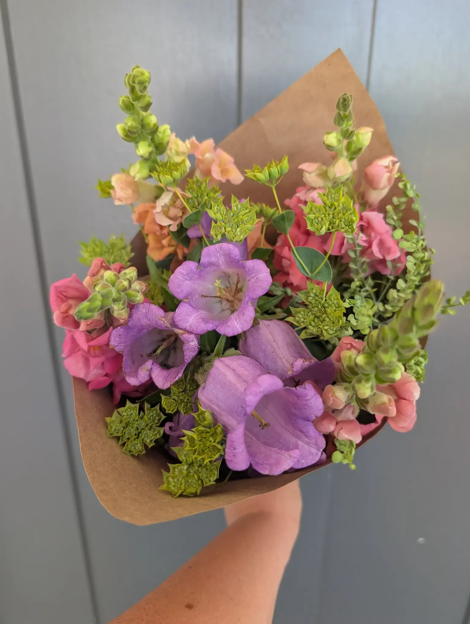 Lush local flower CSA bouquet featuring purple Canterbury bells and seasonal textures for pickup at the Hanover Market CSA.