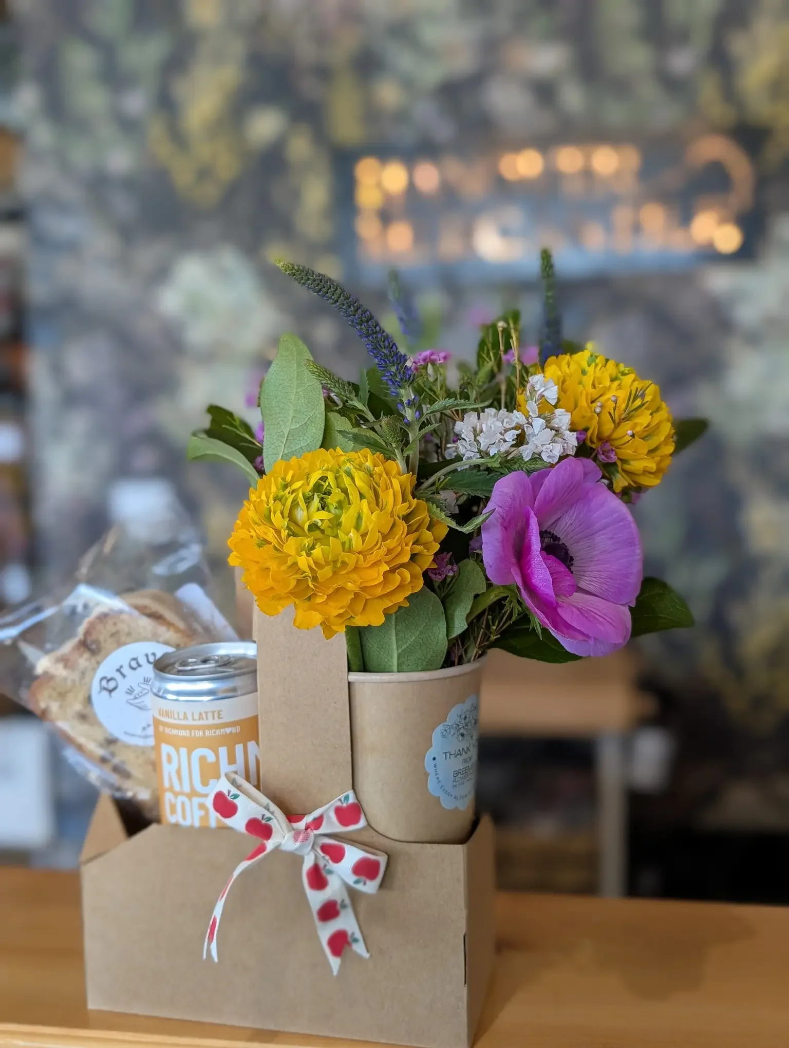 Richmond Coffee Company Vanilla Latte and Gluten-Free Bravo Bakeshop Lemon Loaf slice and seasonal spring bouquet from Breemar Flower Farm for Teacher Appreciation Week