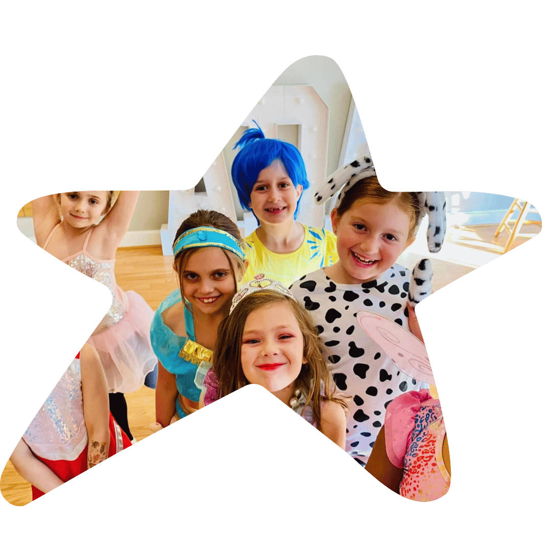 A group of children in colorful costumes celebrating a costume party.