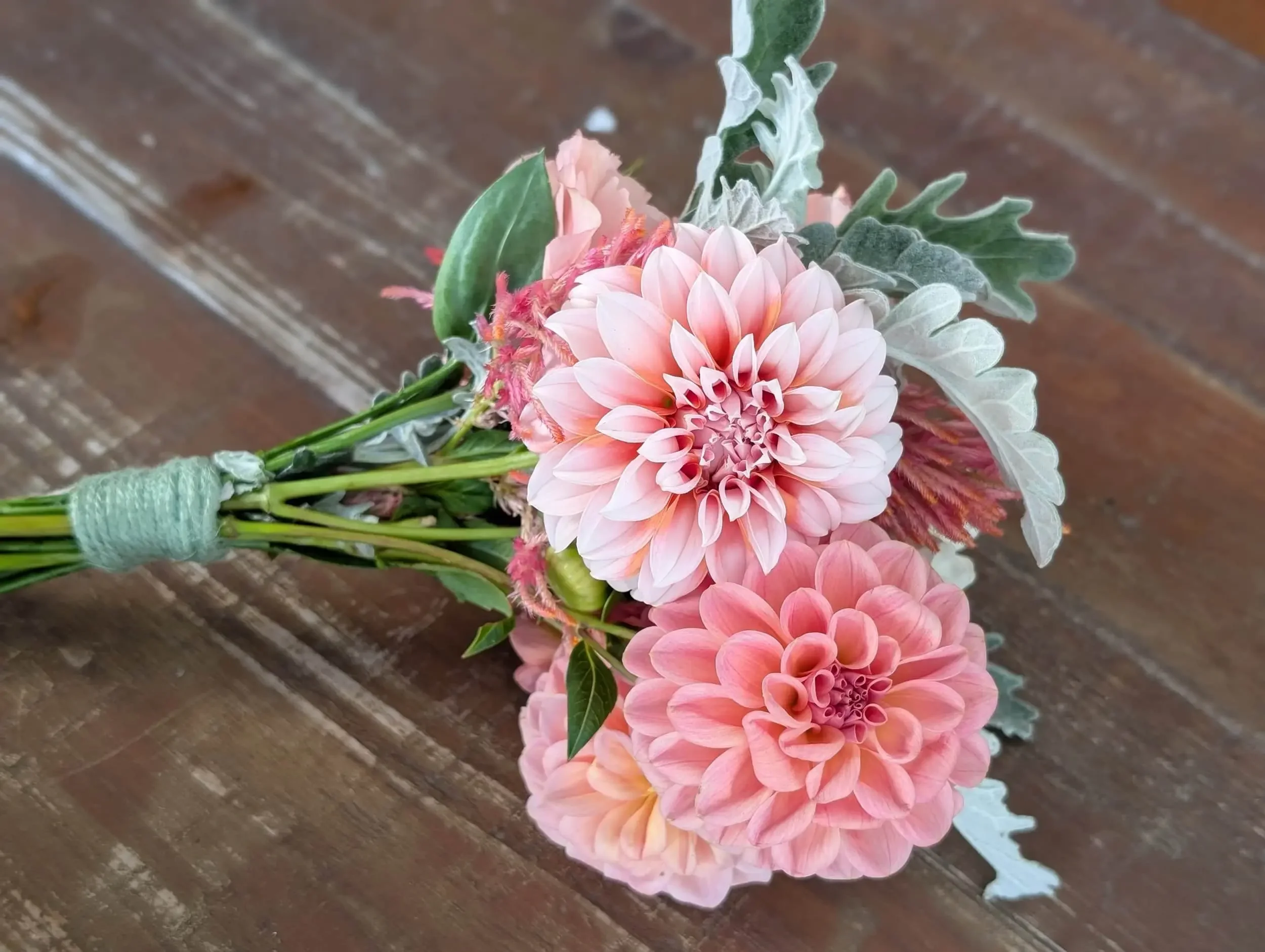 Fresh-cut pink dahlias and seasonal greenery from the cutting garden at Breemar Flower Farm, a local florist in Ashland, VA.