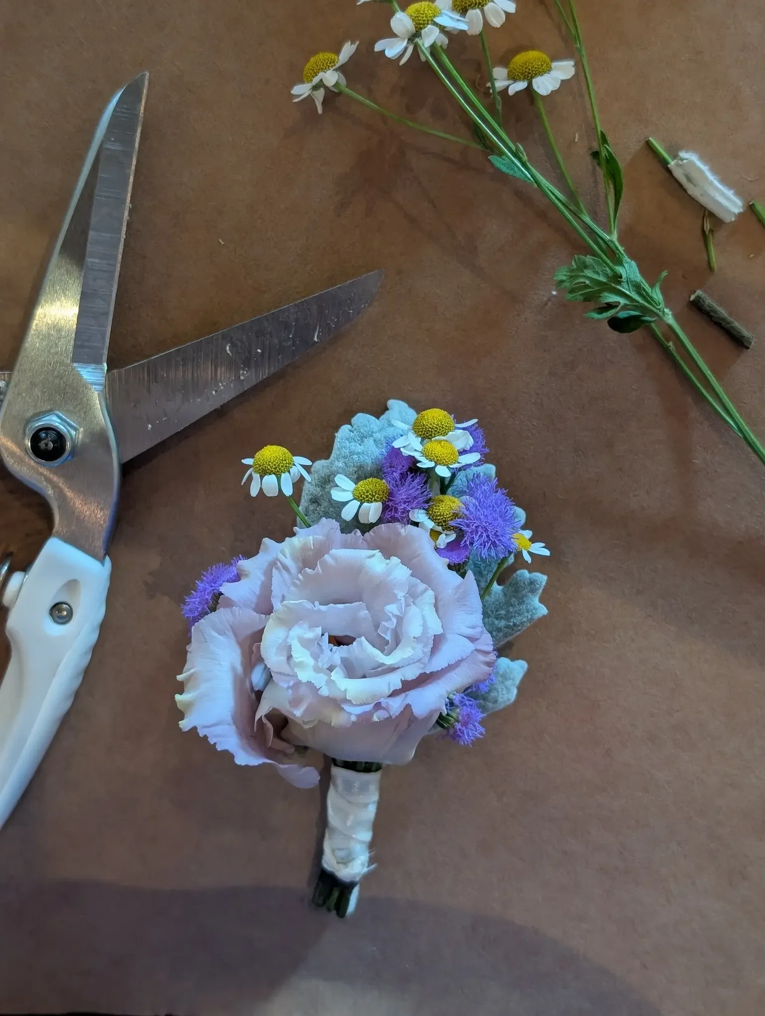 Lavender lisianthus groom boutonniere handcrafted by Breemar Flower Farm for a summer wedding in Richmond, VA.