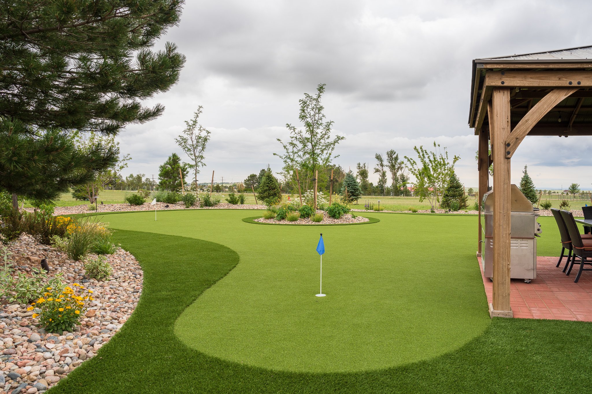 Landscape design with golf course and artificial turf in Gleneagle, CO