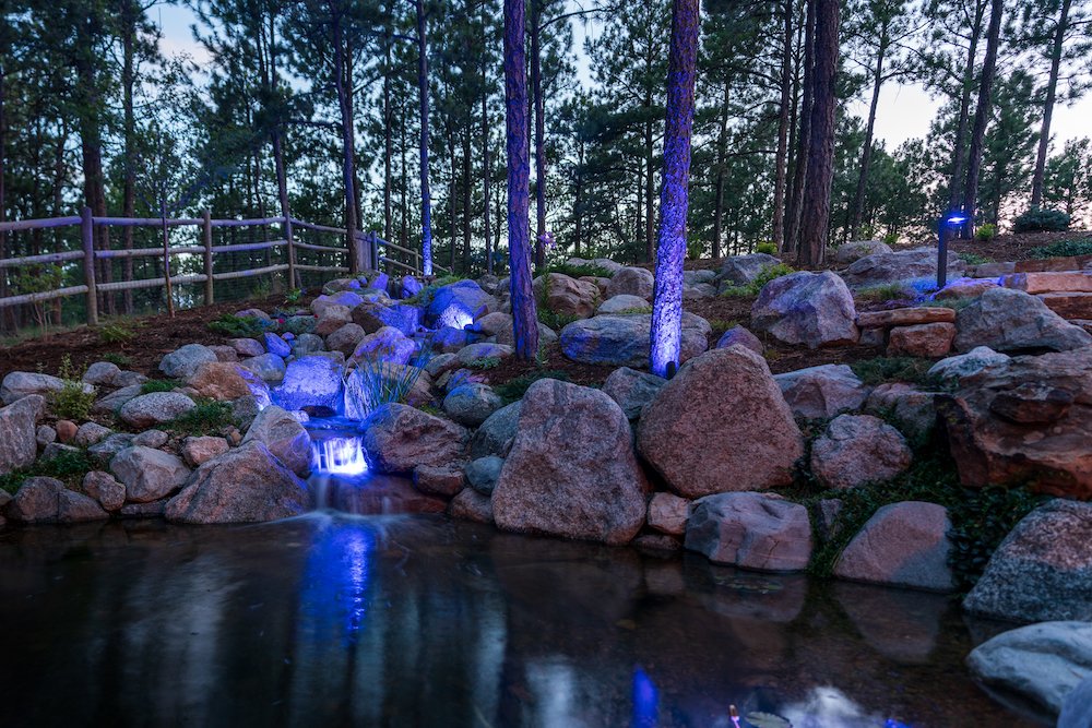 Pond and outdoor lighting in Briargate, CO