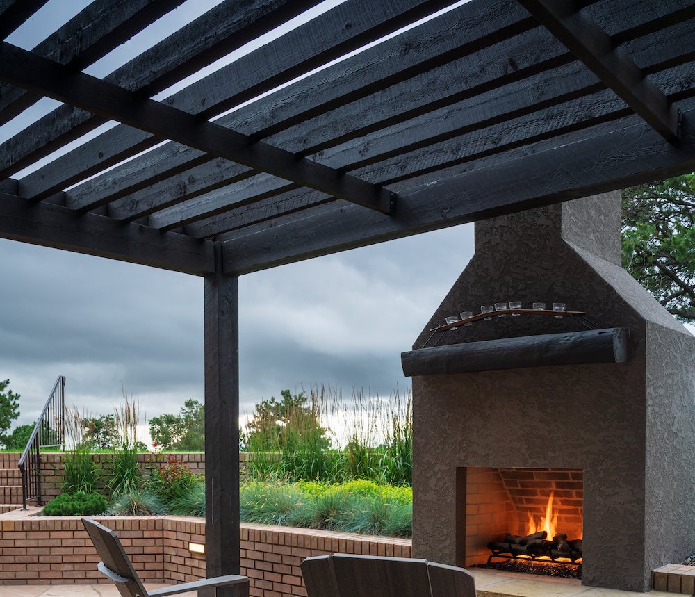 Pergola with outdoor fireplace in Castle Pines, CO