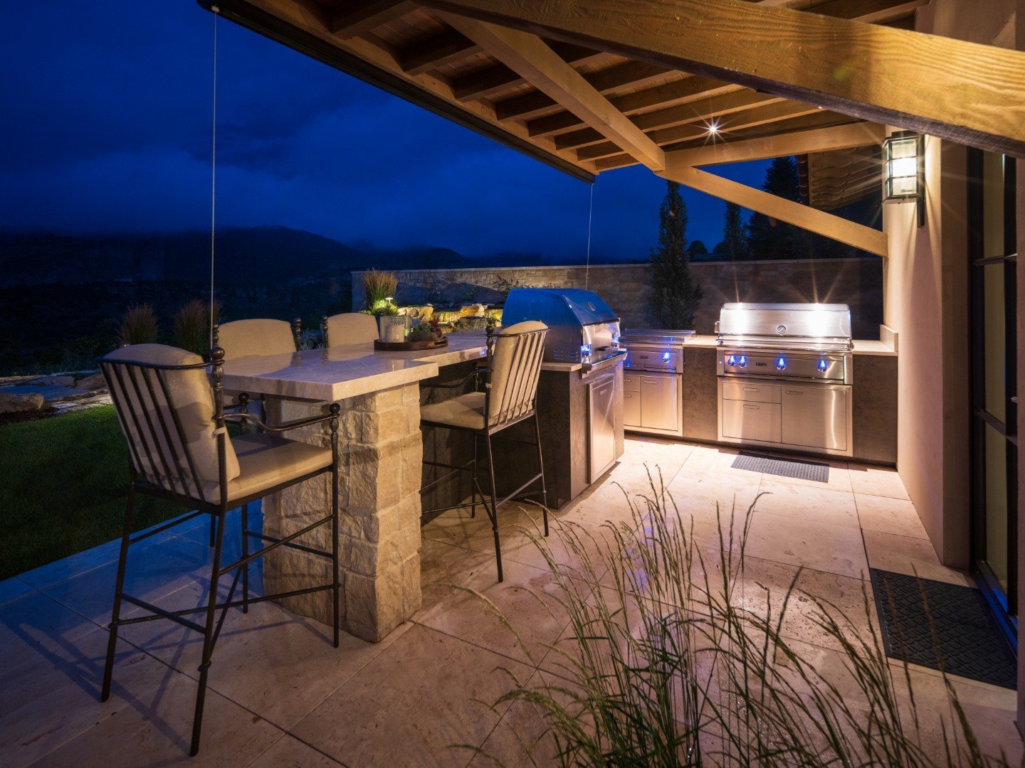 Patio with pergola and outdoor kitchen in Castle Pines, CO