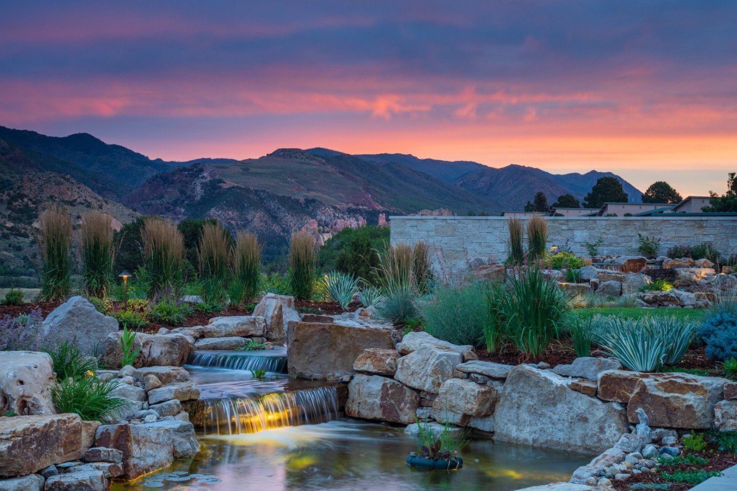 Beautiful landscape design with pond in Colorado Springs, CO