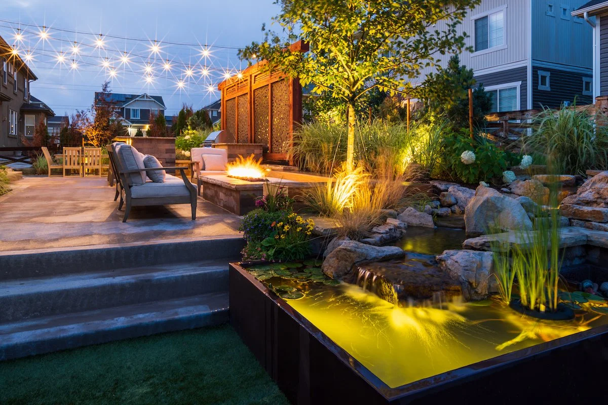Beautiful patio with fire pit and pond in Briargate, CO