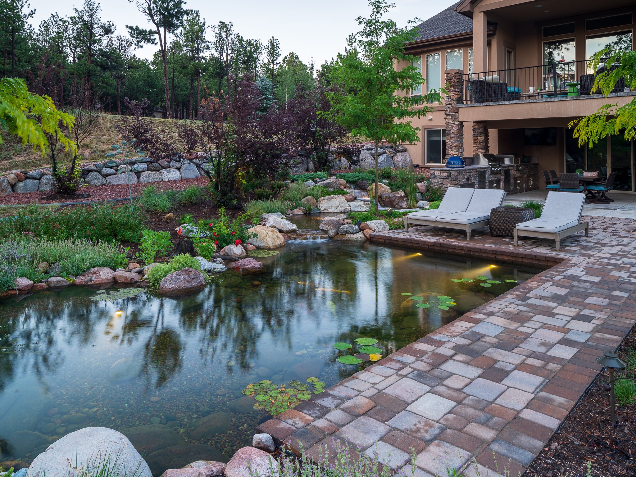 Backyard with pond in Gleneagle, CO