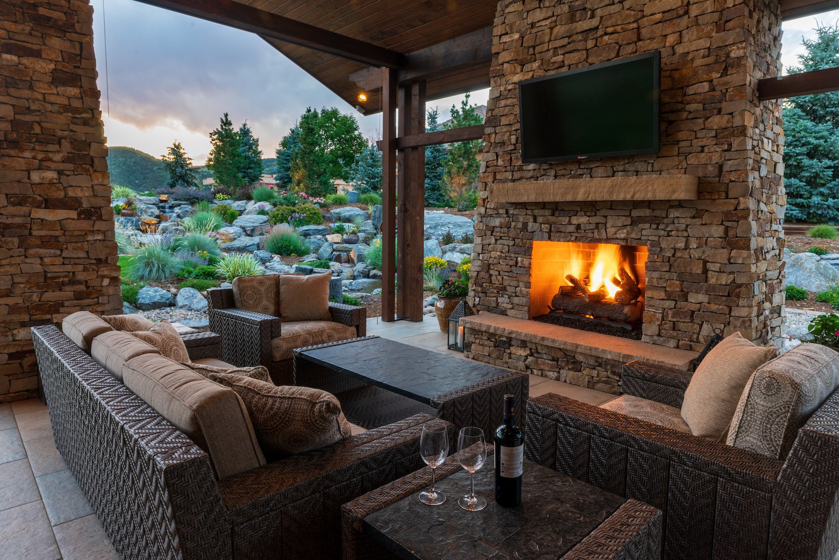 Beautiful landscape design with outdoor fireplace in Castle Rock, CO