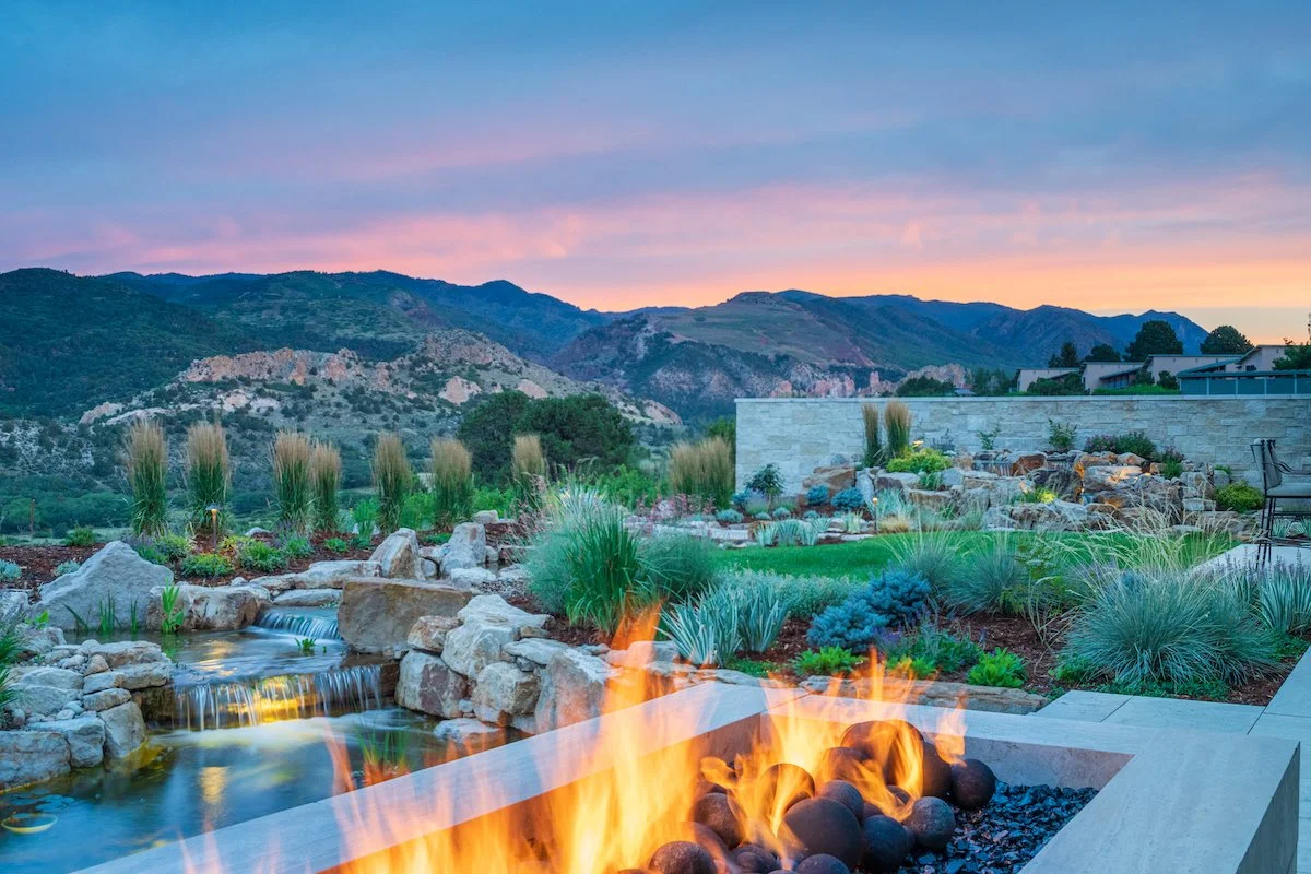 Landscape design with patio, fire pit and pond in Castle Rock, CO