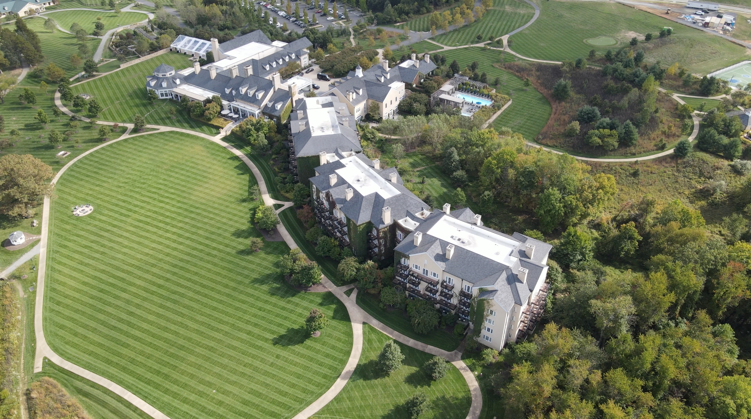 Commercial landscaping with structured plantings and lighting in Ashburn, VA