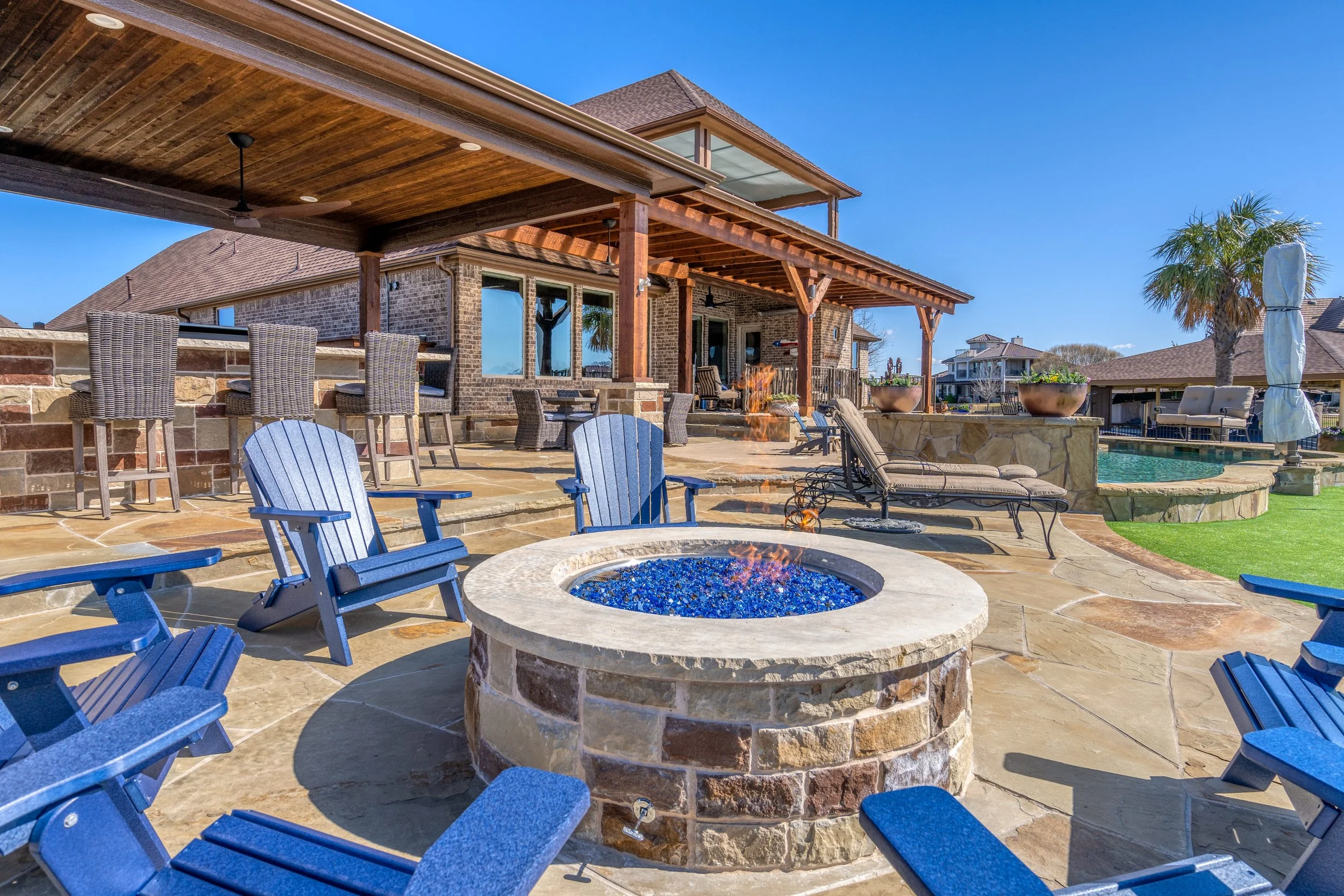 Stone patio with fire pit and outdoor fireplace in Trophy Club, TX