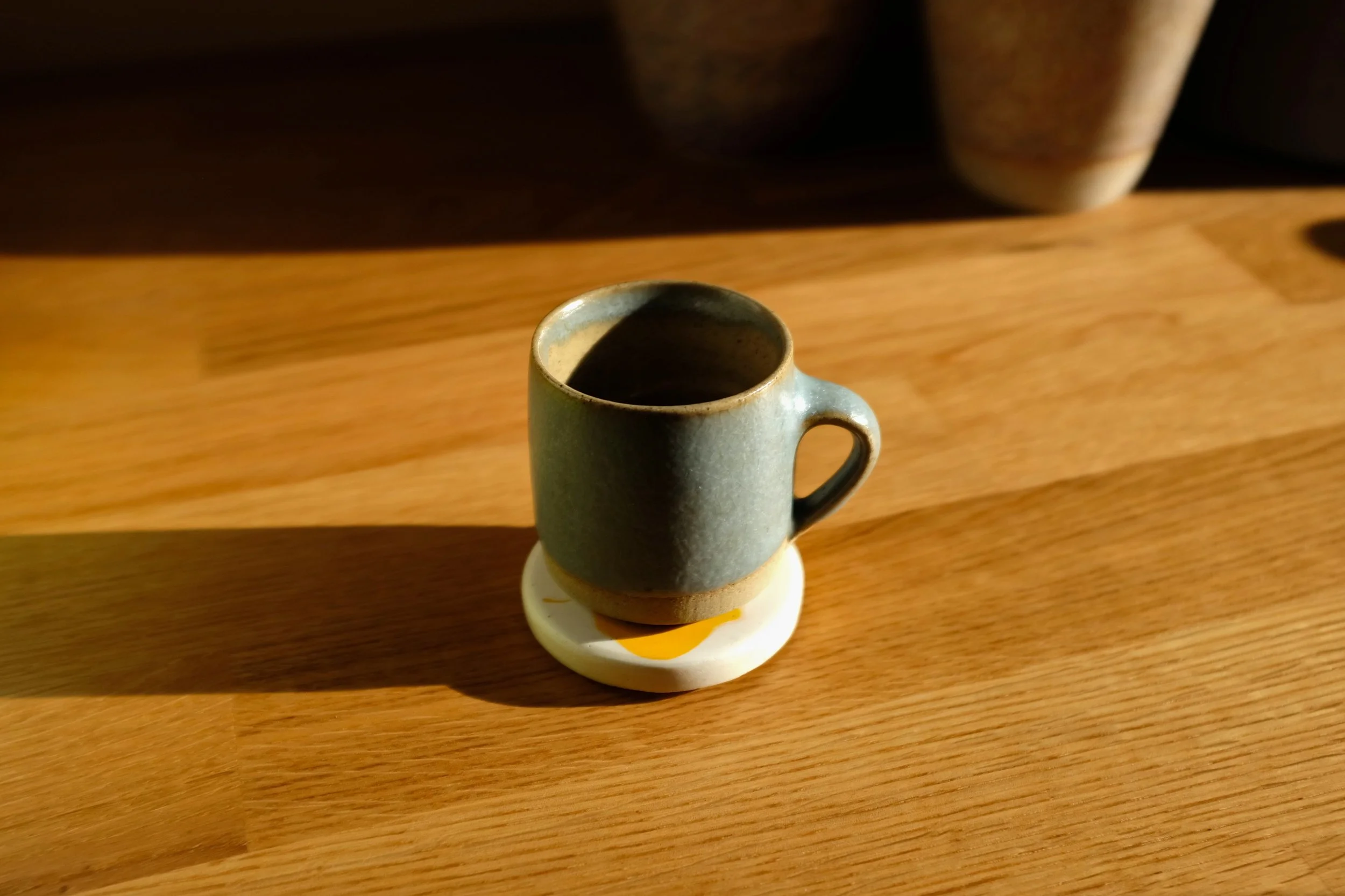 White Yellow Espresso Coaster.JPG