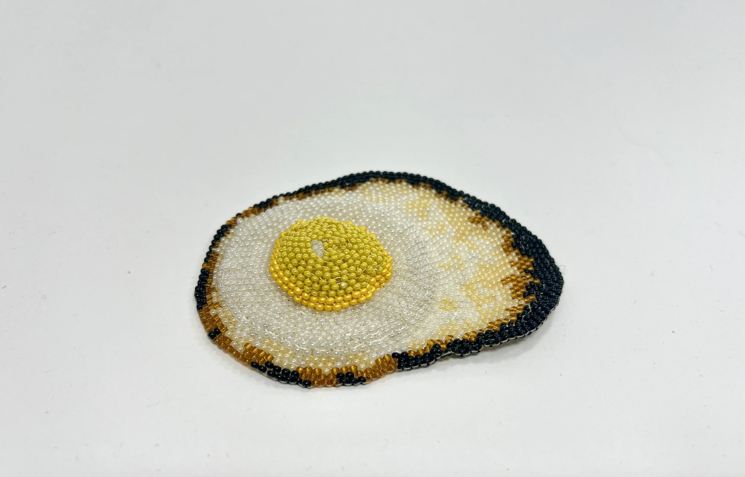 Burnt Out (Feeling Fried? series)
Alt Title: DE20260401-02.
1" x 3.75 x 3"
Glass seed beads, polyester thread. 
$70.00