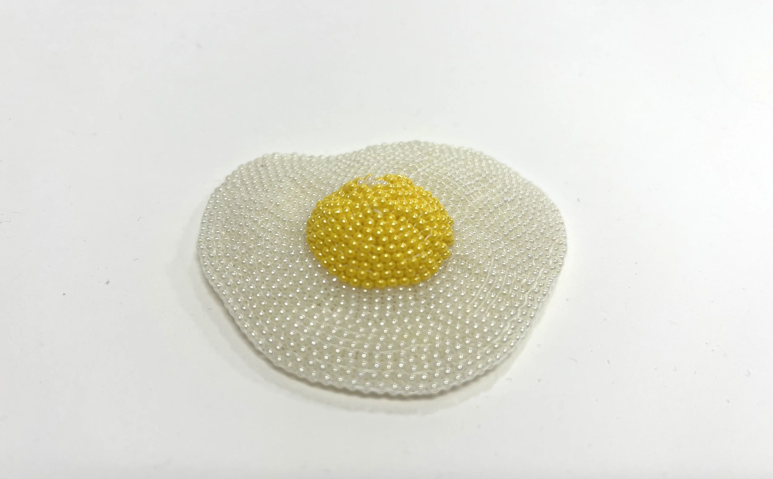 No (Feeling Fried? series)
Alt Title: DE20260427-04.
1" x 3." x 3"
Glass seed beads, polyester thread. 
$70.00 