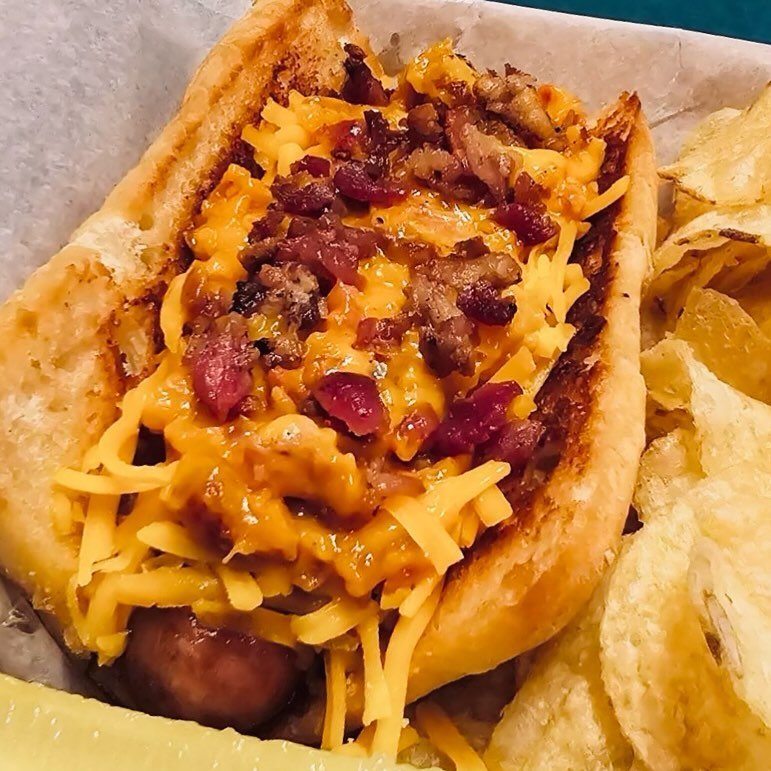 The Cheesy Bacon Blitz Dog is what bacon and cheese dreams are made of &mdash; bacon infused nacho cheese sauce, shredded cheddar and more bacon 🌭🧀🥓

This weekend only!

#restaurants #restaurant #food #foodie #foodporn #foodlover #iowa #iowa_views