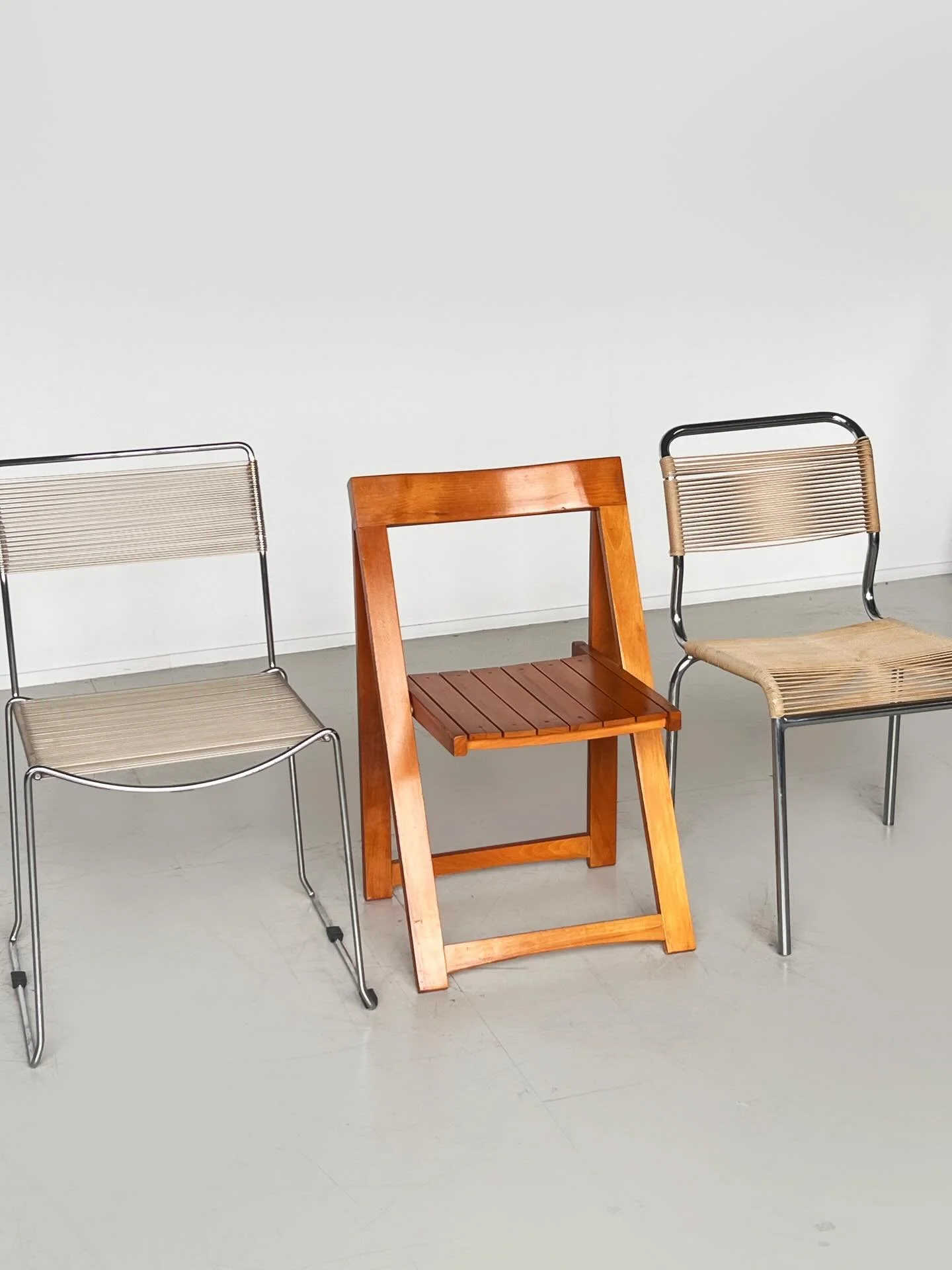 Trieste folding chair, an iconic 1960&rsquo;s design attributed to Aldo Jacober for Alberto Brazanni. A solid wood chair with slatted seat and angled frame. The structure leans toward the functional clarity seen in Italian design during this period. 