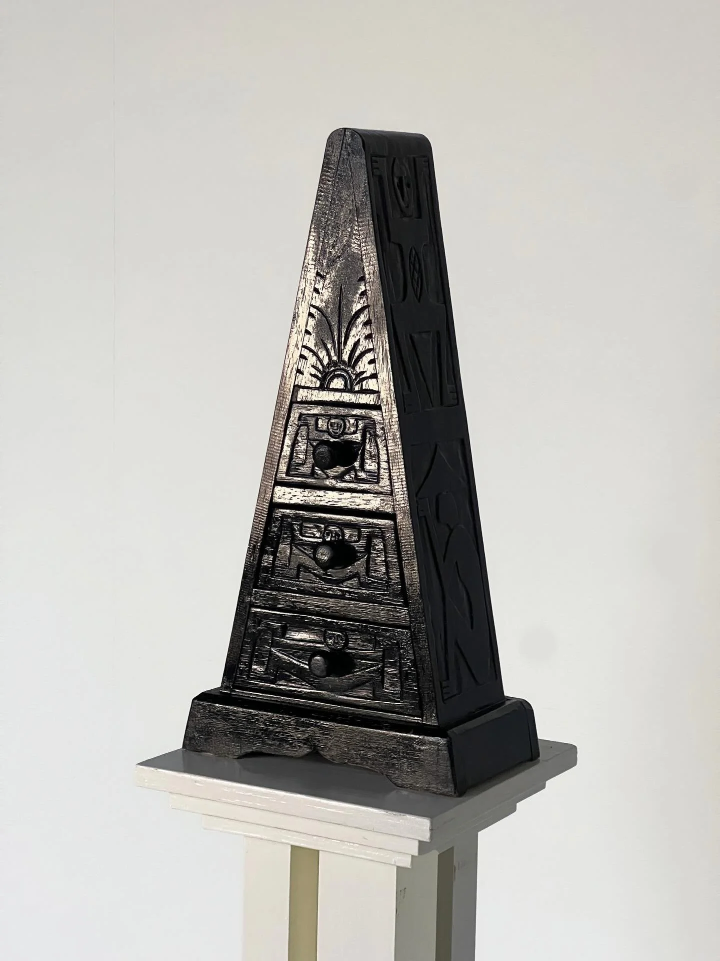 Triangle chest of drawers with carved timber profile, a completely unique storytelling item with character carvings covering 3 sides. This item celebrates ageing and wear. 

Available for sale + hire via the website