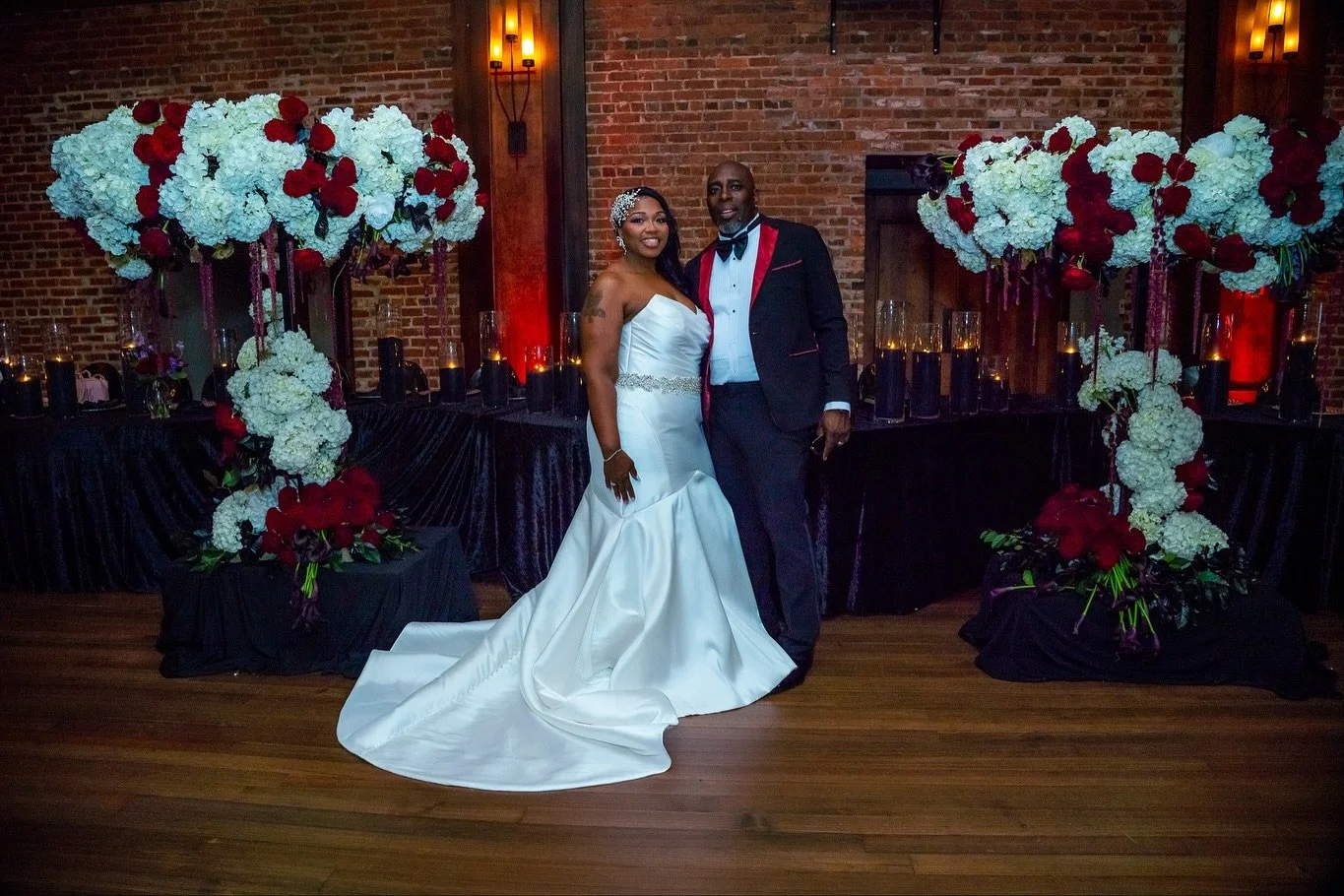 A floral design meant to command the room.
Deep reds for passion, white hydrangeas for purity, black accents for sophistication &mdash; every bloom chosen with intention.

Monique &amp; Damond gave me the freedom to create something powerful, romanti