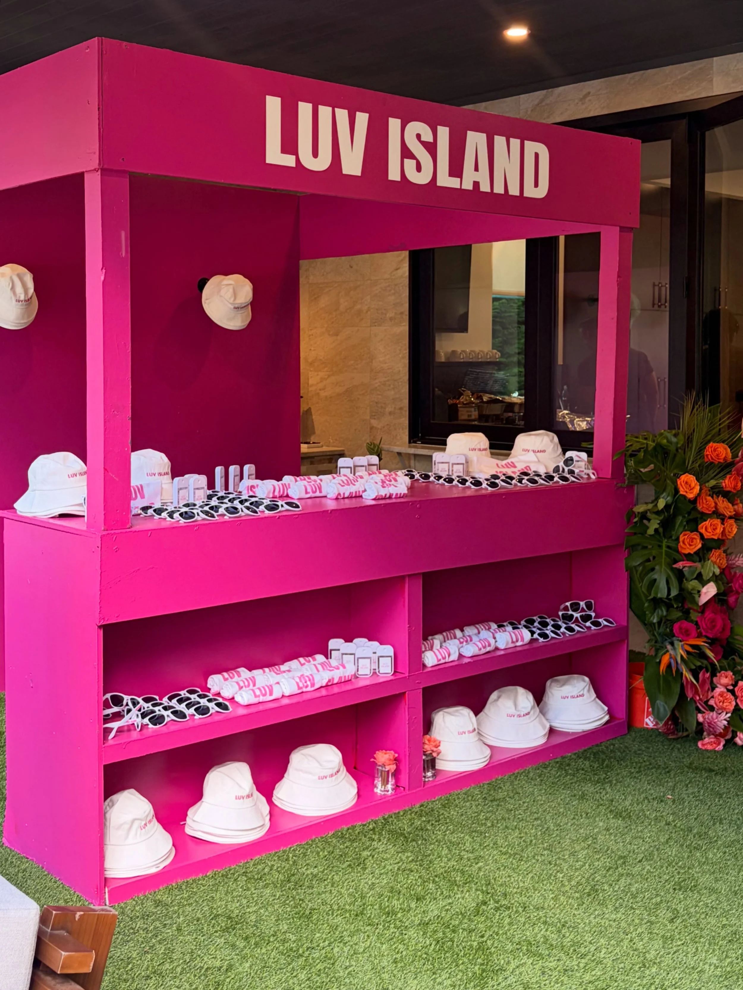 Welcome to the LUV ISLAND Bodega. 🩷🌴

Because when you create your own island, you need your own store too.

Custom LUV ISLAND bucket hats, sunglasses and branded goodies were waiting for guests to grab and wear throughout the celebration.

This is