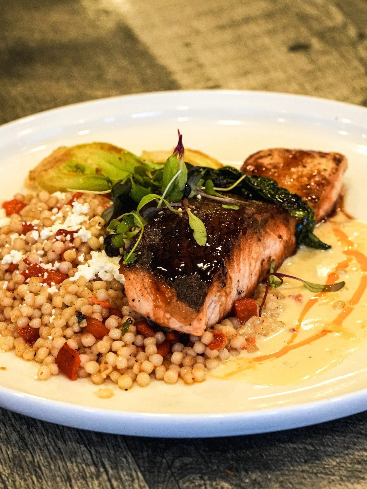 Live Music with Code 51 Thursday at 6 PM
-
New season, new flavors ❄️🐟 Our winter menu continues to shine with another standout addition.

Introducing Landing Salmon ✨ perfectly prepared and served with fluffy couscous, roasted peppers, and feta che