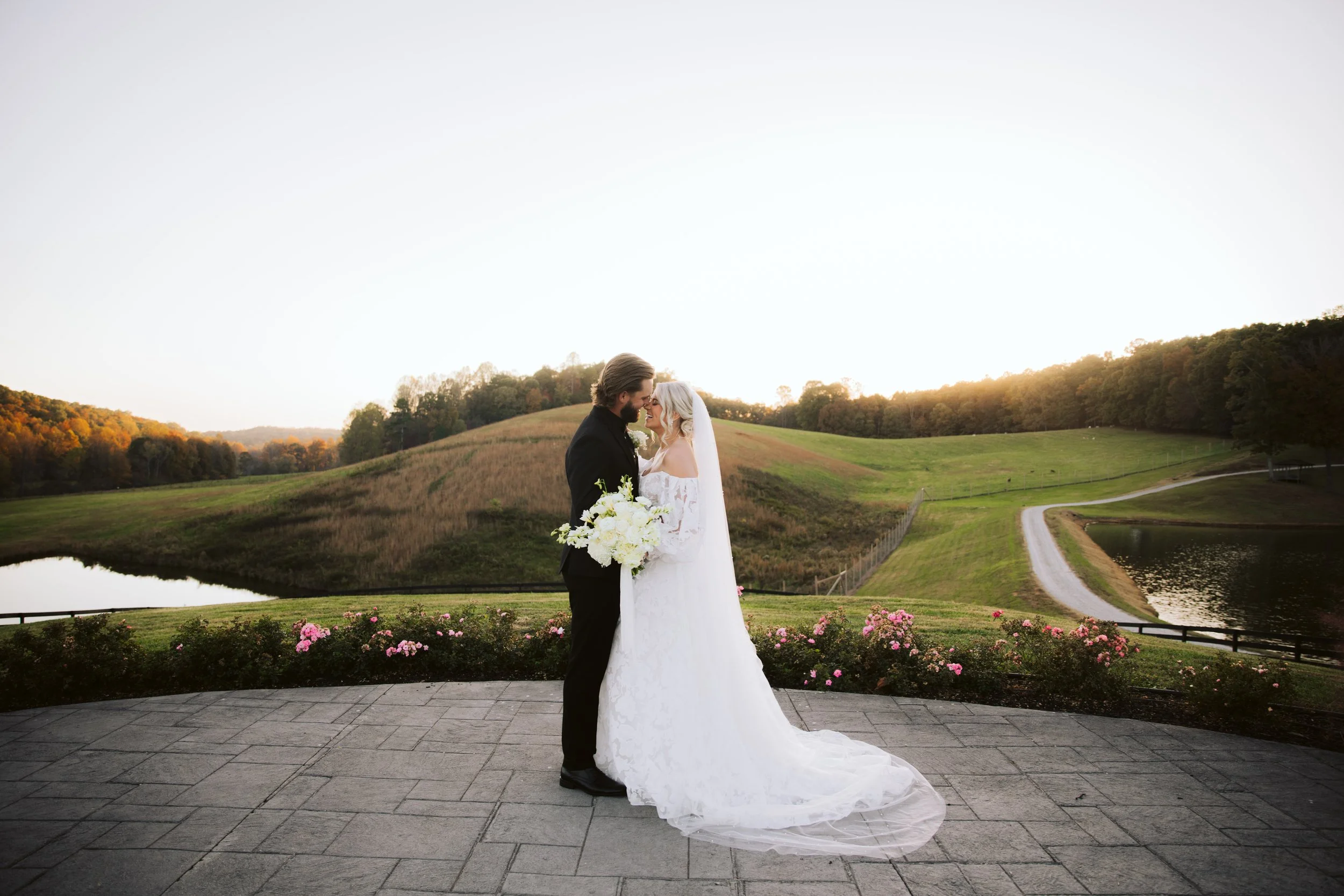 Elegant Vineyard Wedding Kiss at Sunset