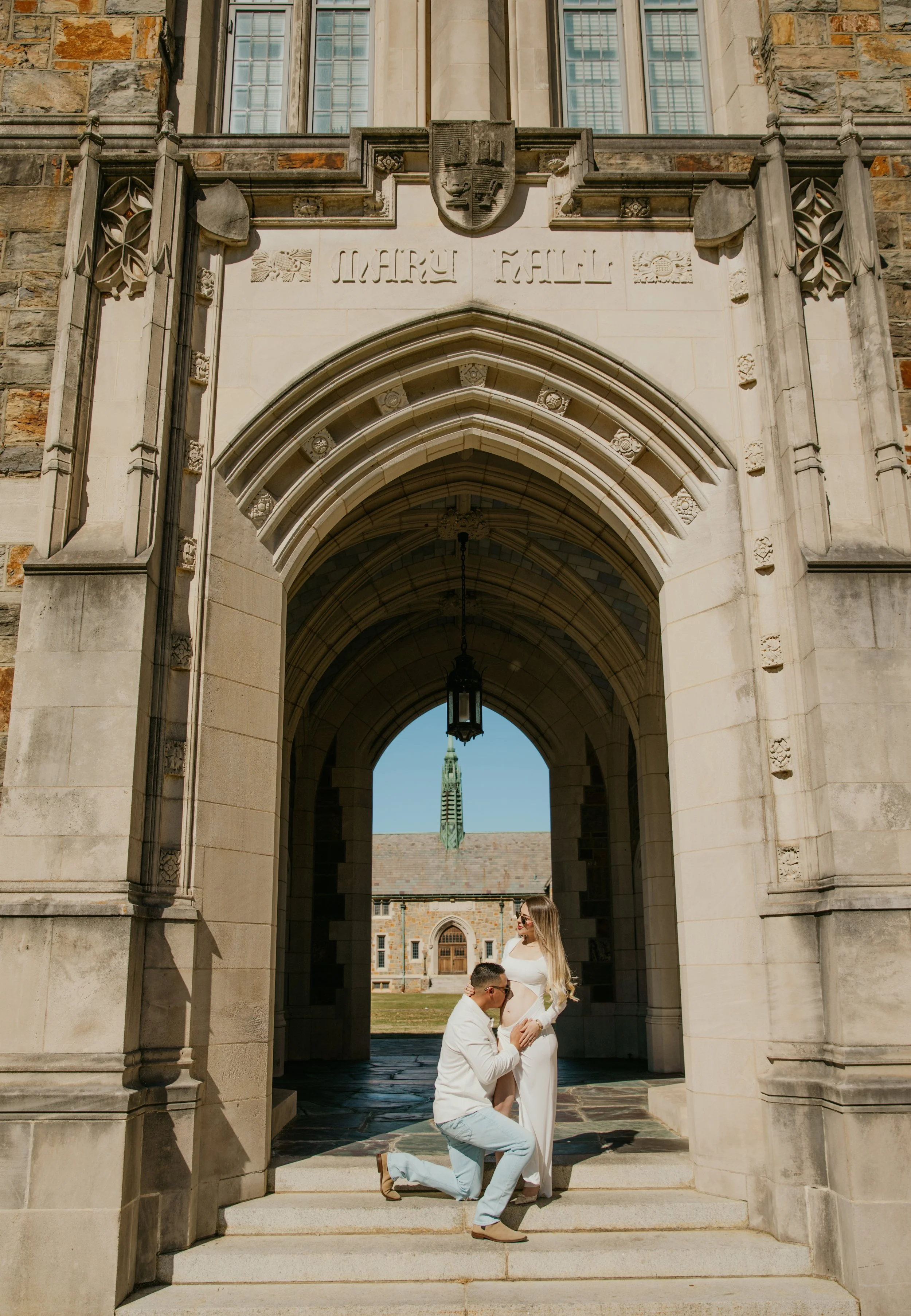 Romantic couple sitting together under gothic archway