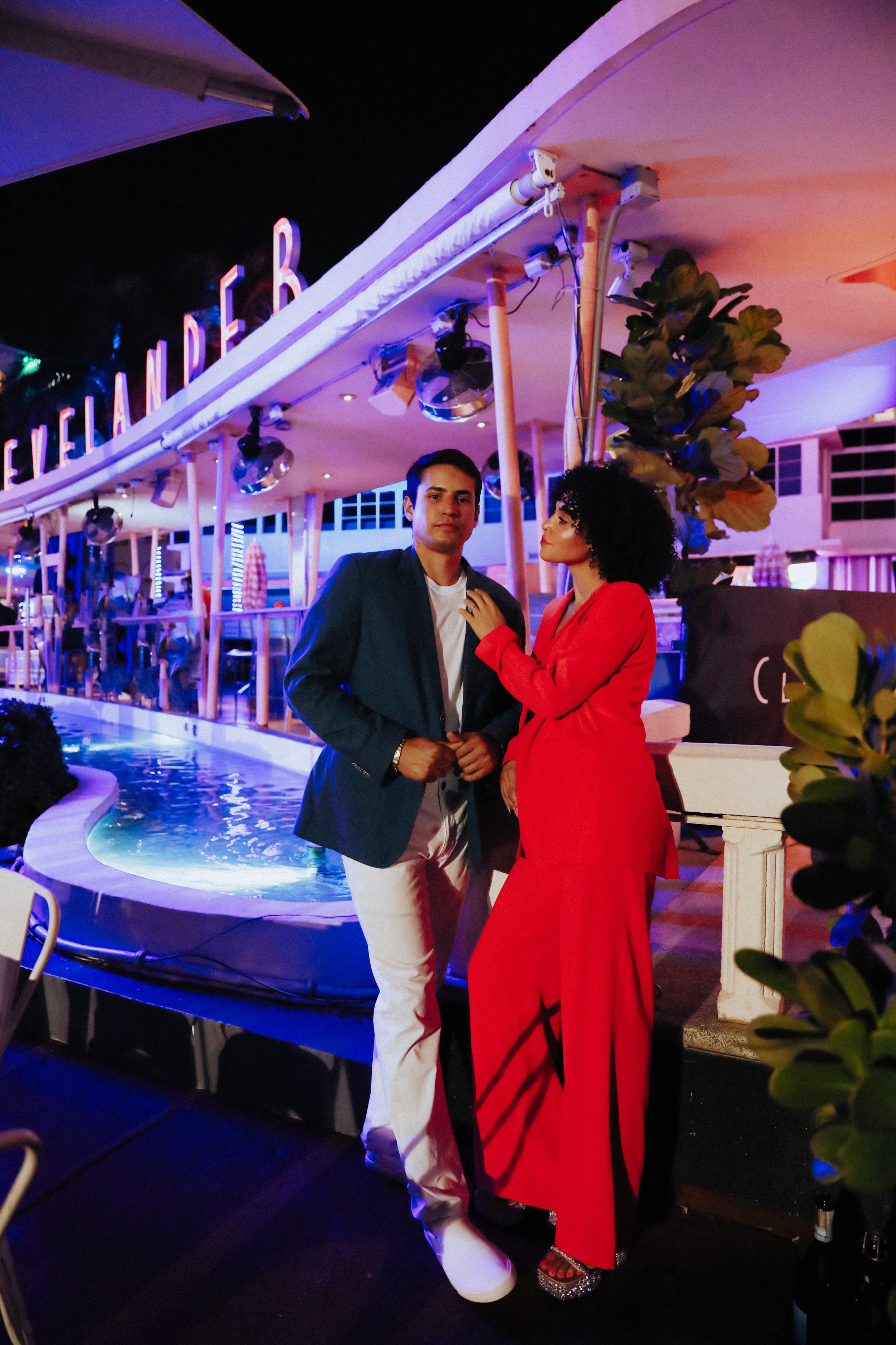 Stylish engagement photo at night with city lights