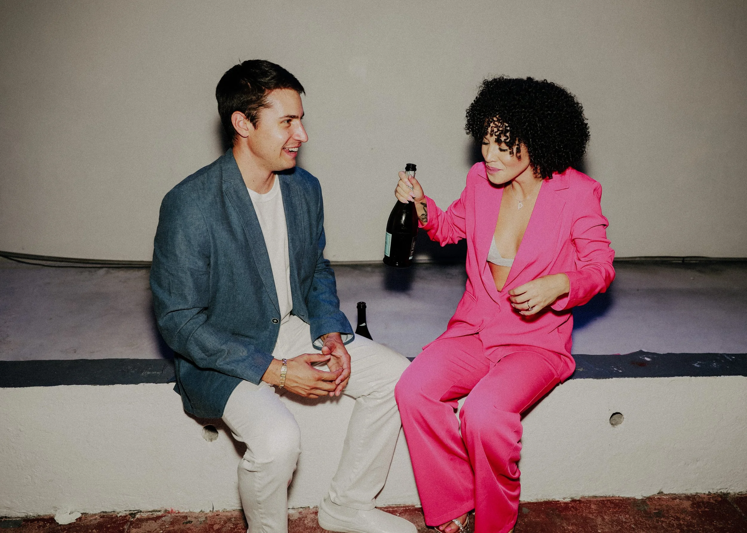 Couple sitting together during candid engagement moment