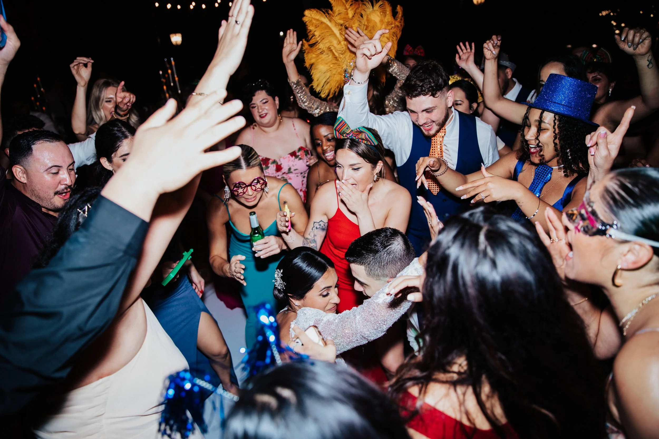 Candid wedding reception photos with guests partying