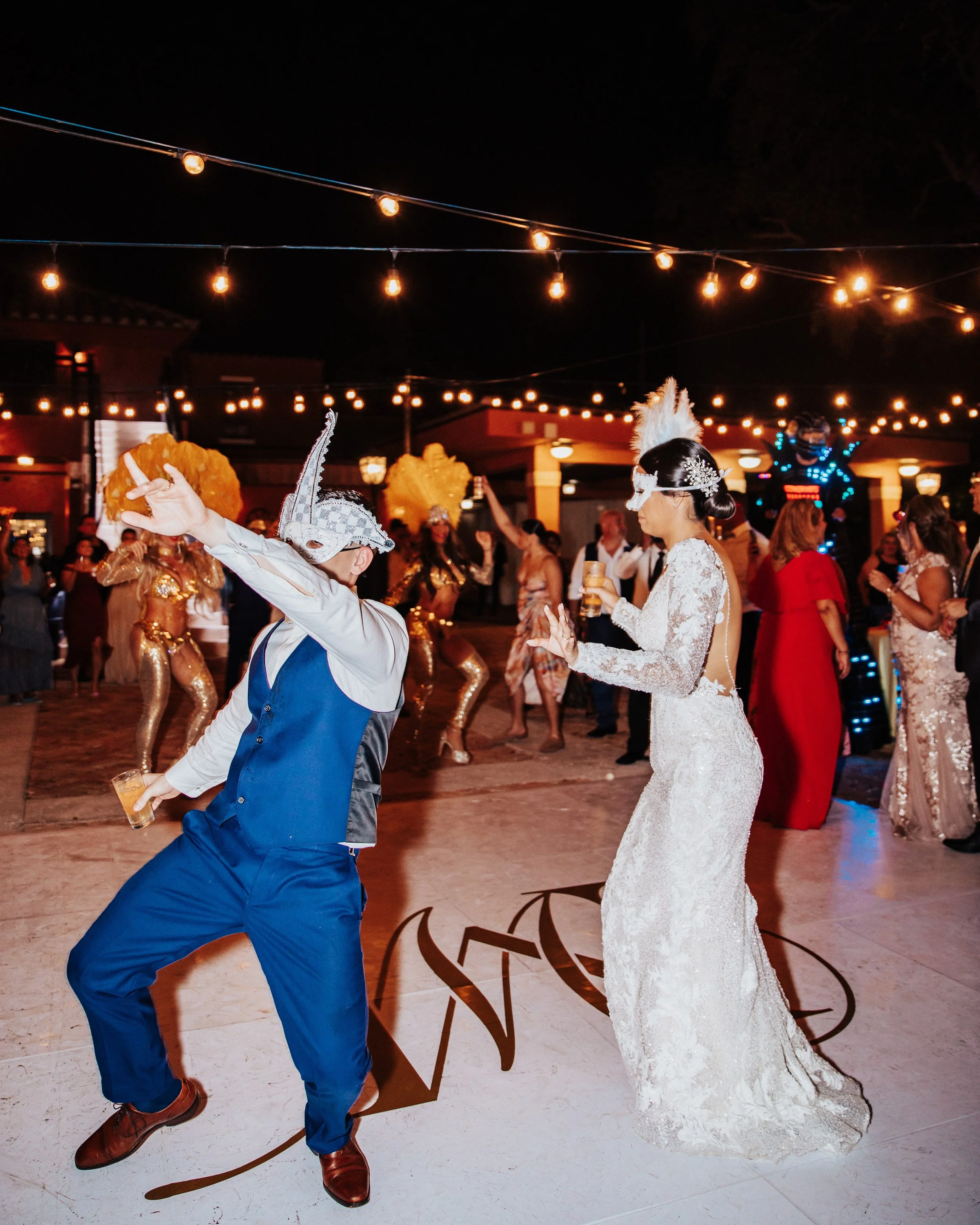 Bride and groom dancing with champagne celebration