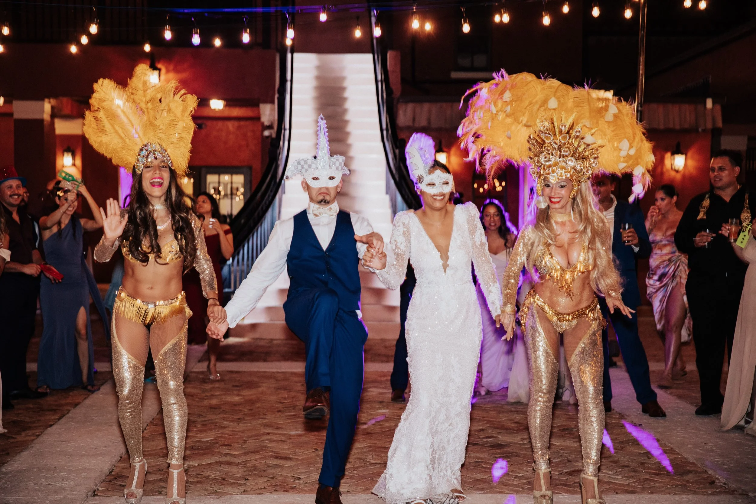 Bride and groom entering reception with performers