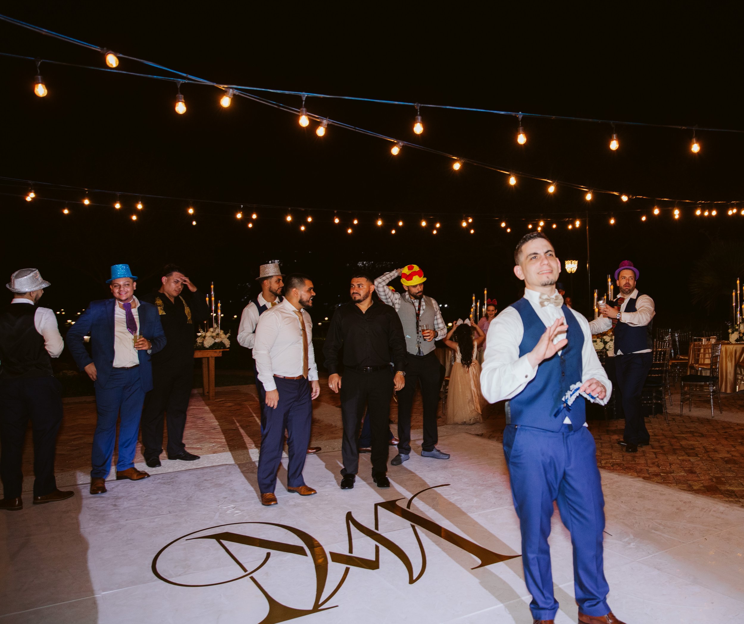 Groom giving speech at outdoor wedding reception