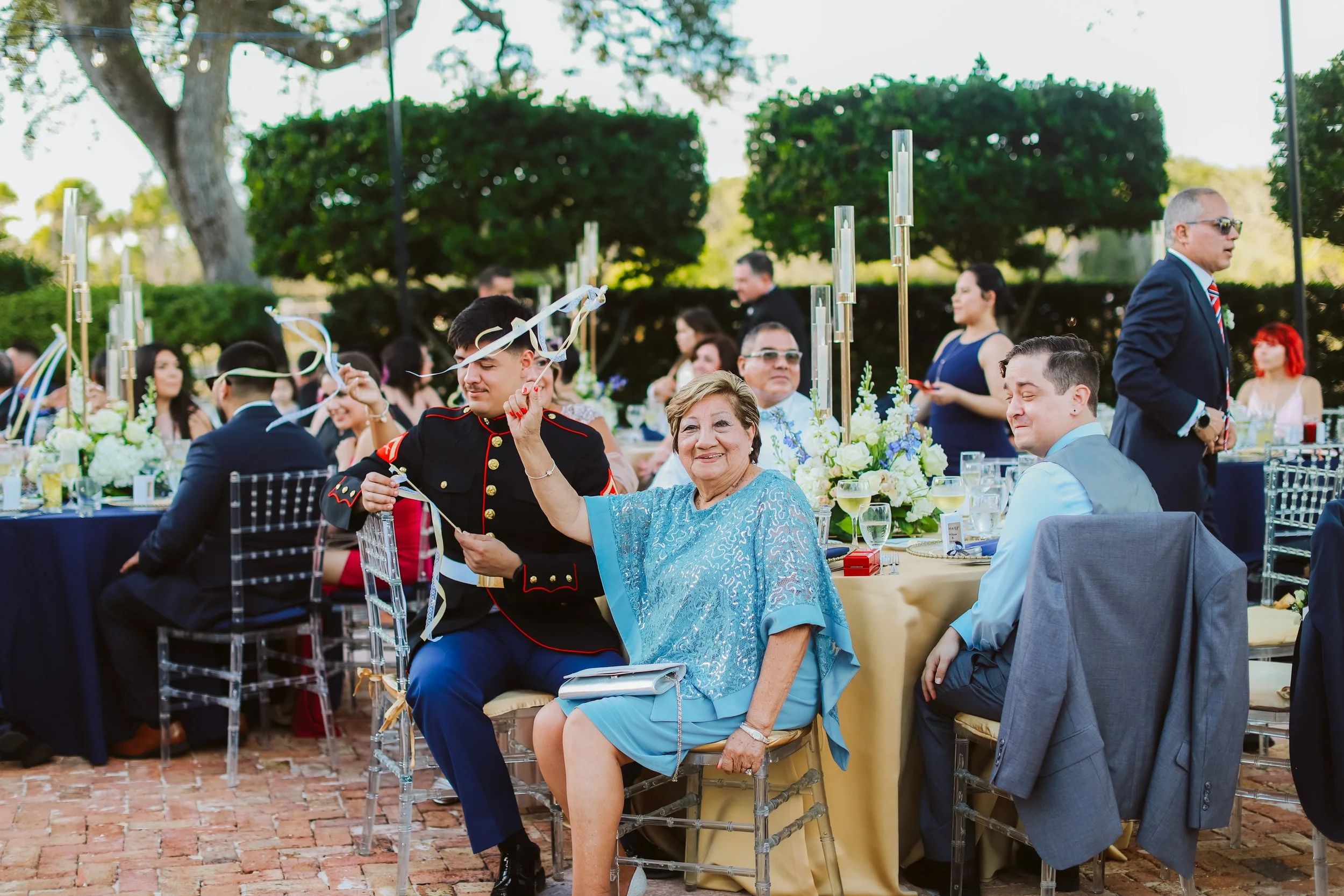 Guests seated and celebrating at wedding reception tables