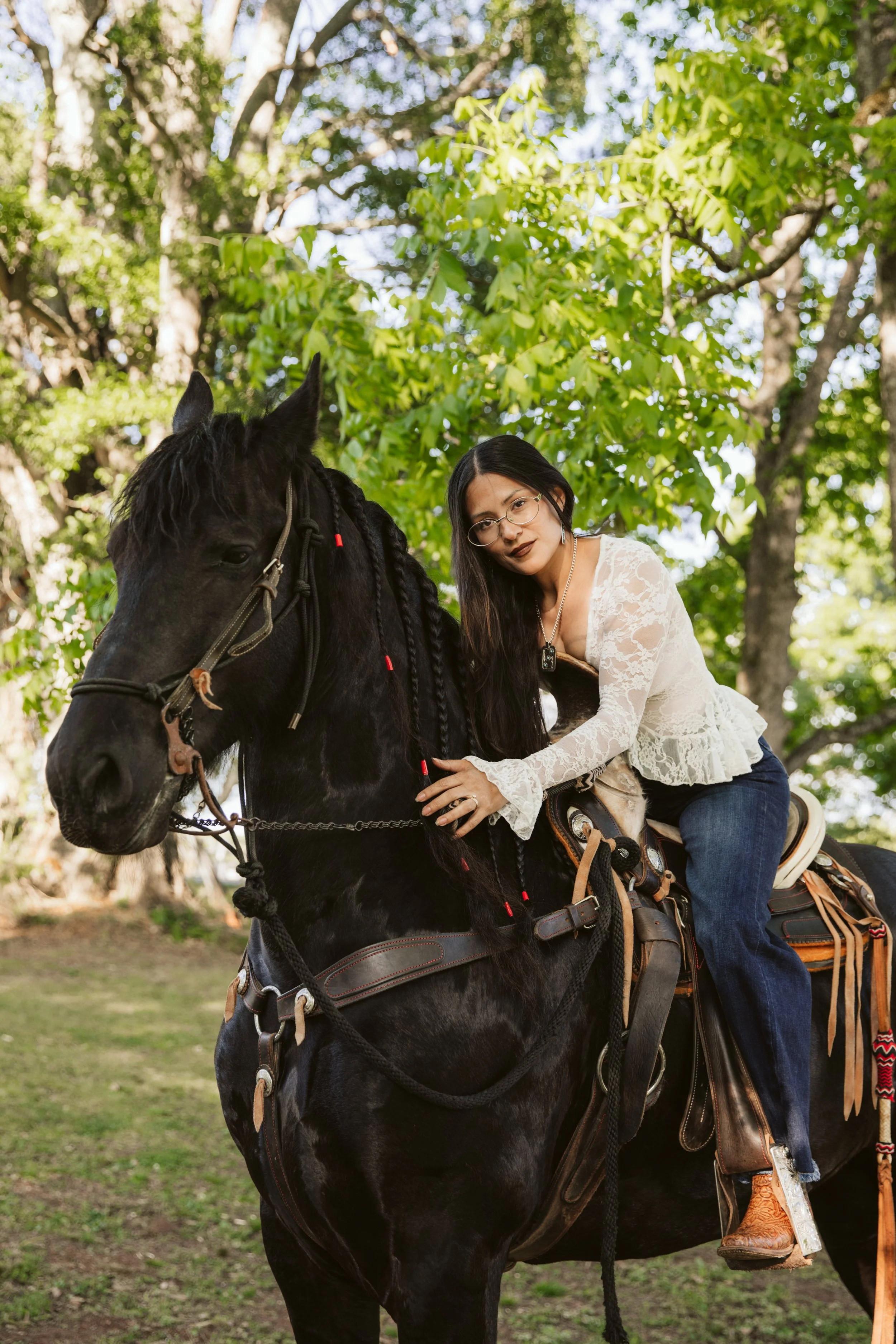 Woman posing with Friesian horse in Georgia