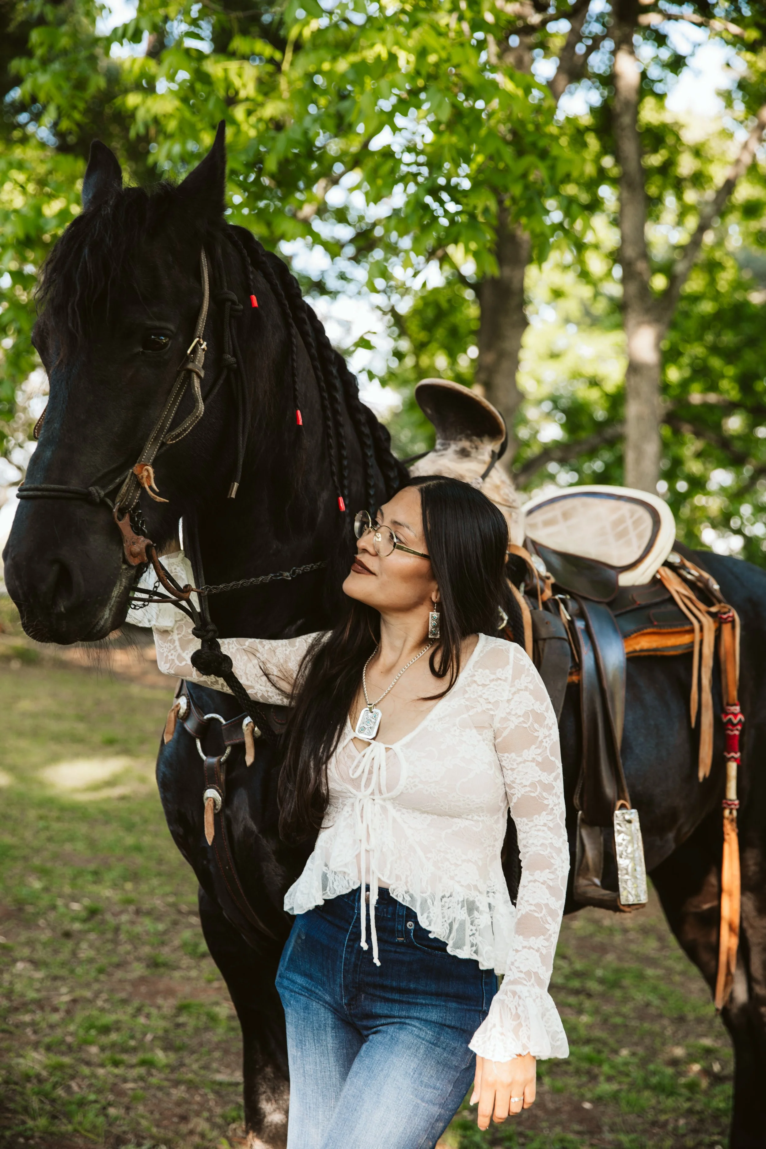 Equestrian portrait with black Friesian horse