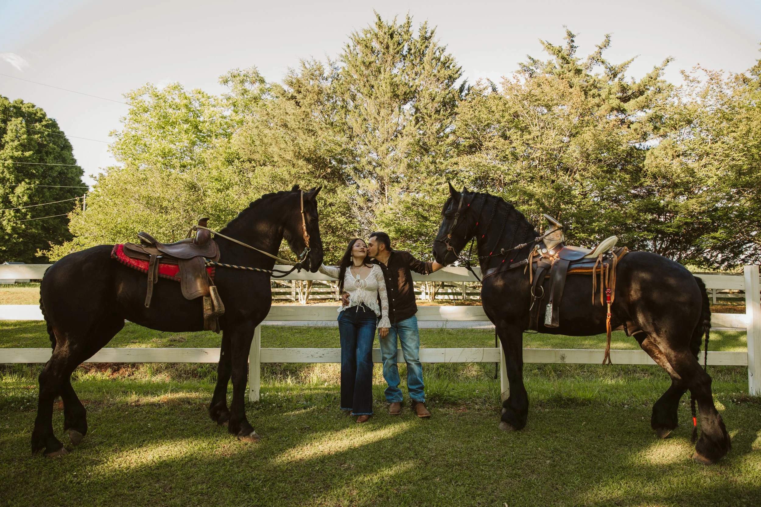 Couples portrait with Friesian horses in Georgia