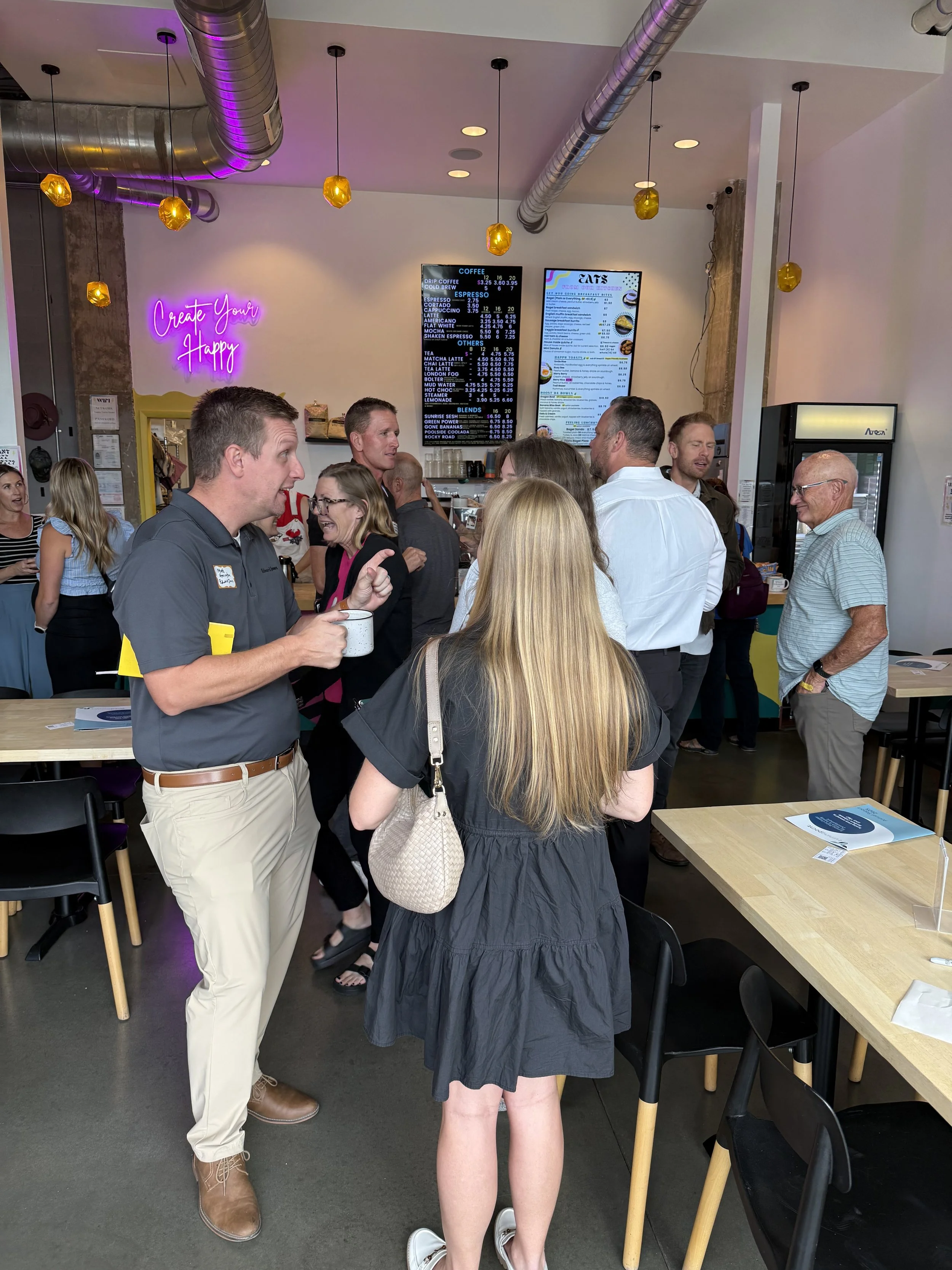 Group of professionals networking and working together at a Rally NoCo event