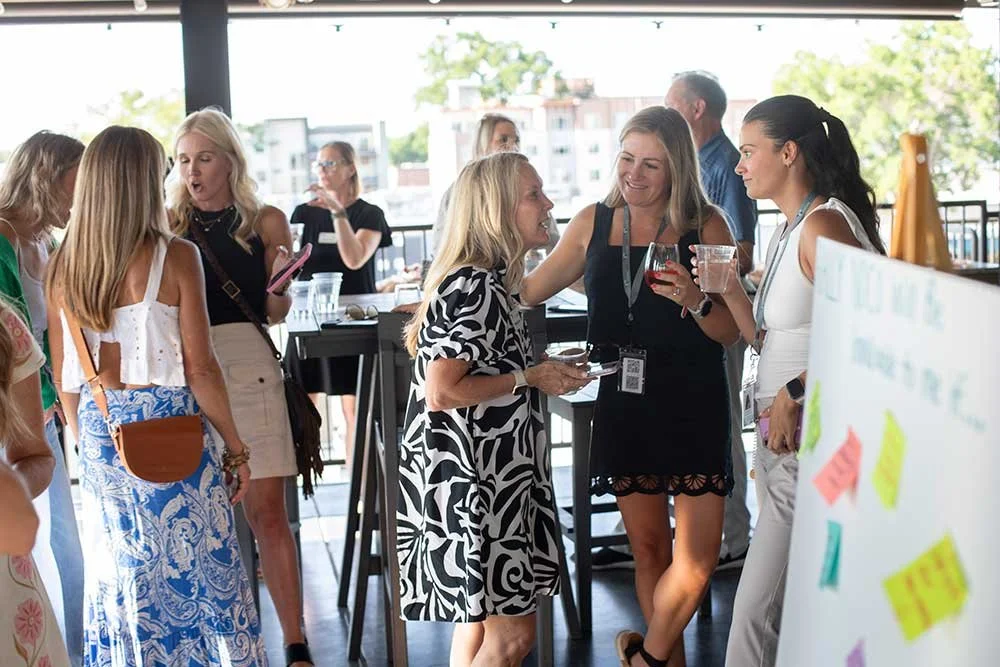 Group of young professionals networking at a Rally NoCo Event