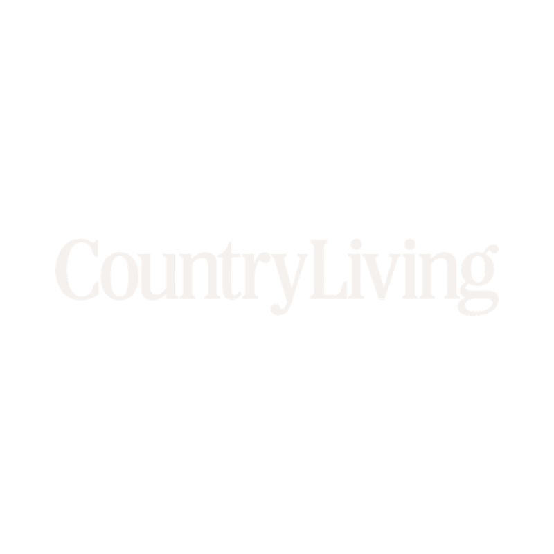 Logo for Country Living magazine featuring an illustration of a rooster and the text 'Country Living' in large white font.