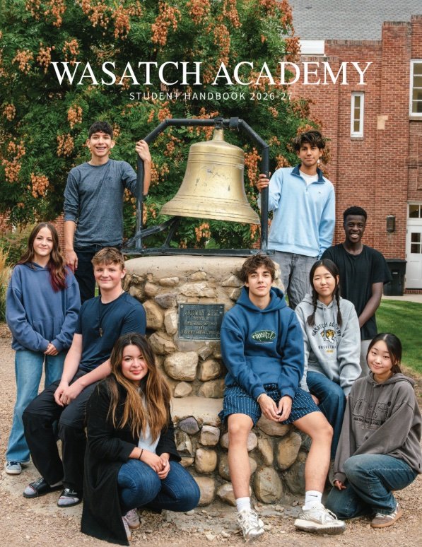 Cover of student handbook showing students around the school bell