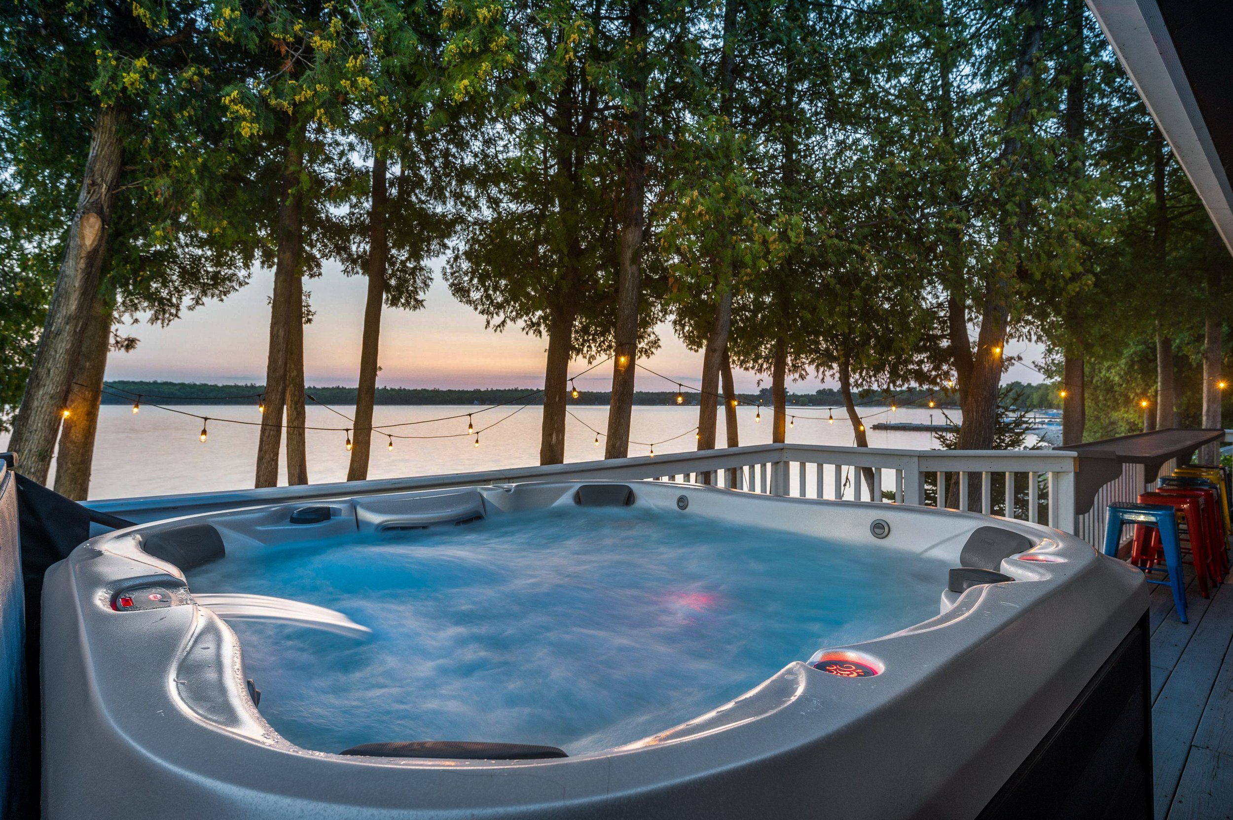 2 - Unwind and relax in the 6 person hot tub overlooking the water. .jpg