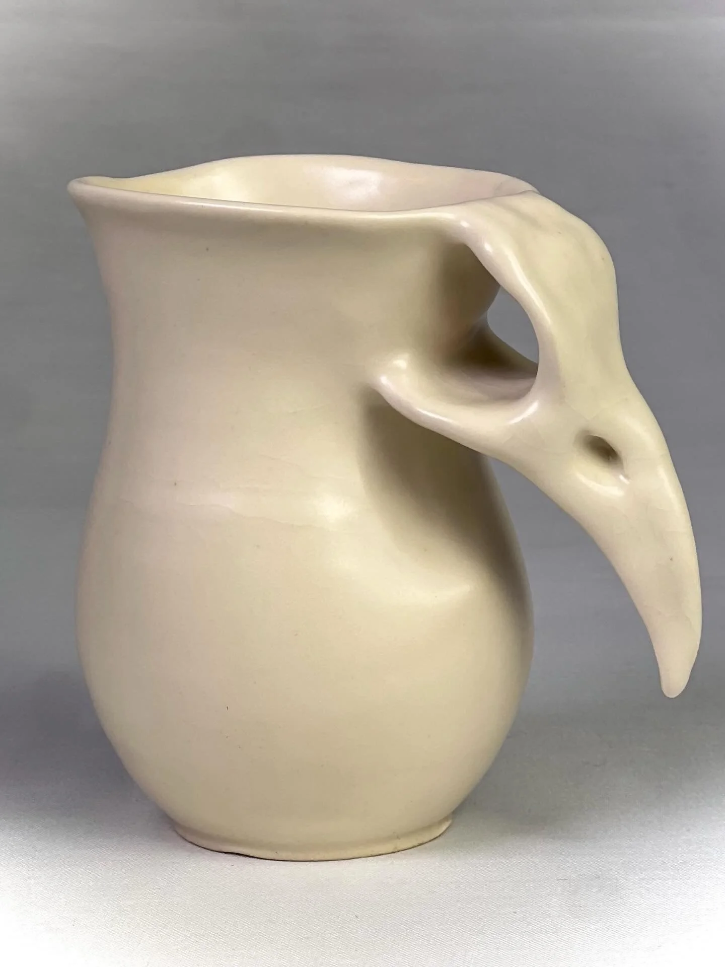 Altered crow mug made of porcelain, 2026. This feels like a step forward for me. I look forward to exploring this form and clay 🤍